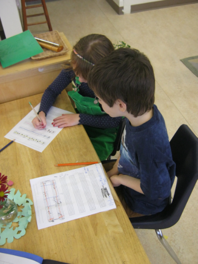 Kevin teaches a friend how to write music.