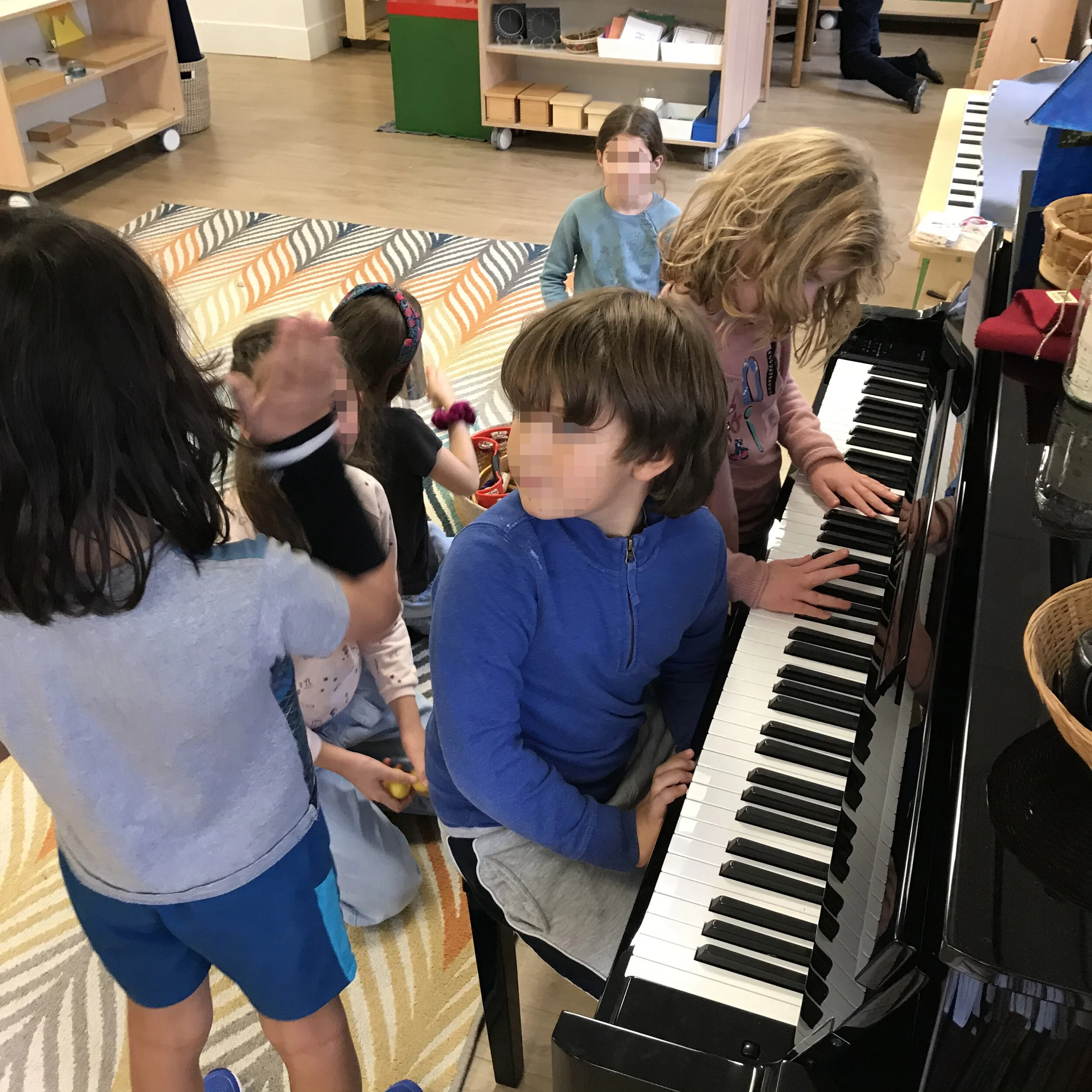 The orchestra getting their parts together.