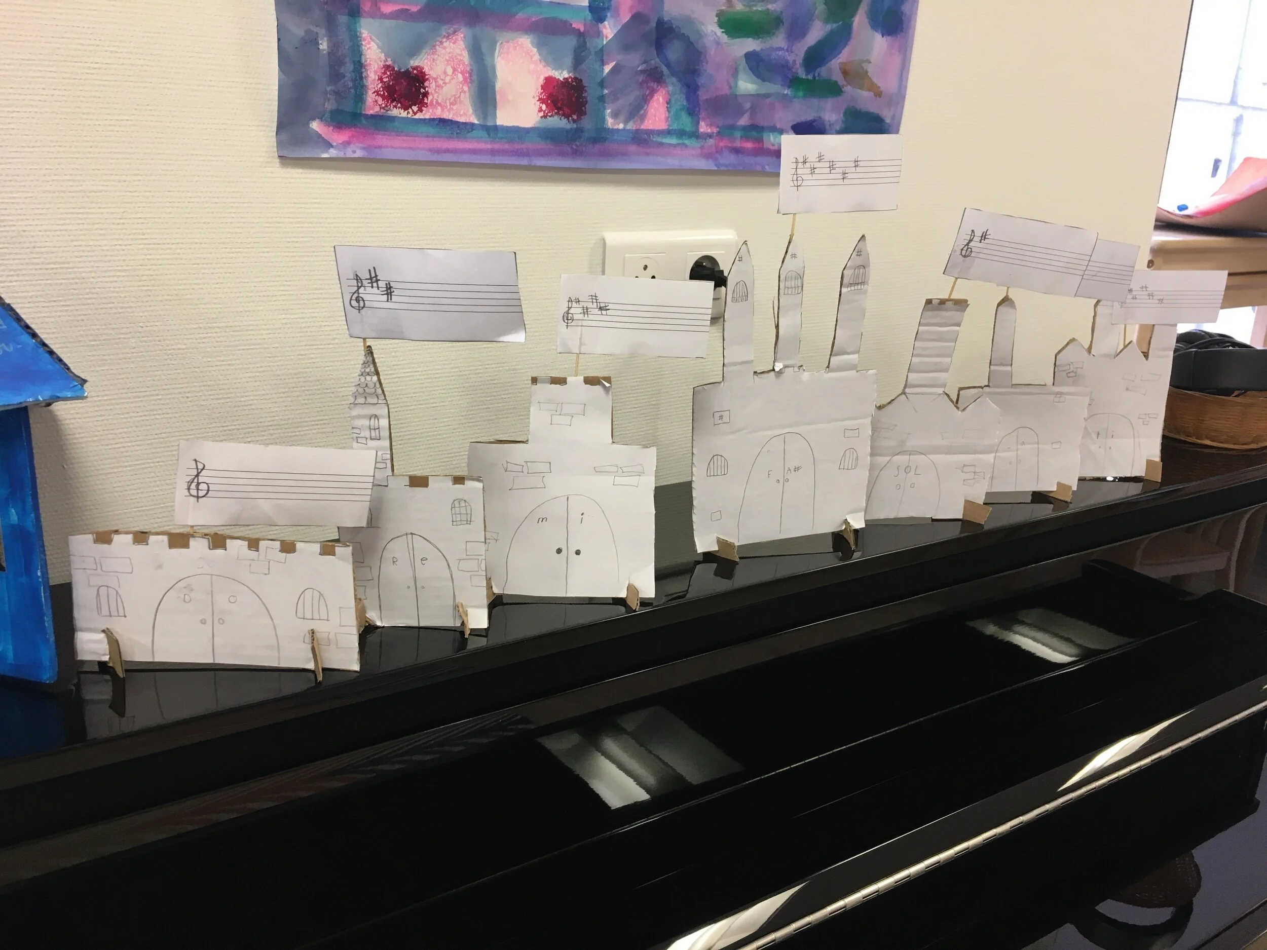And here are all of the castles of the sharp keys in order from left to right, displayed, appropriately, on top of the classroom piano.