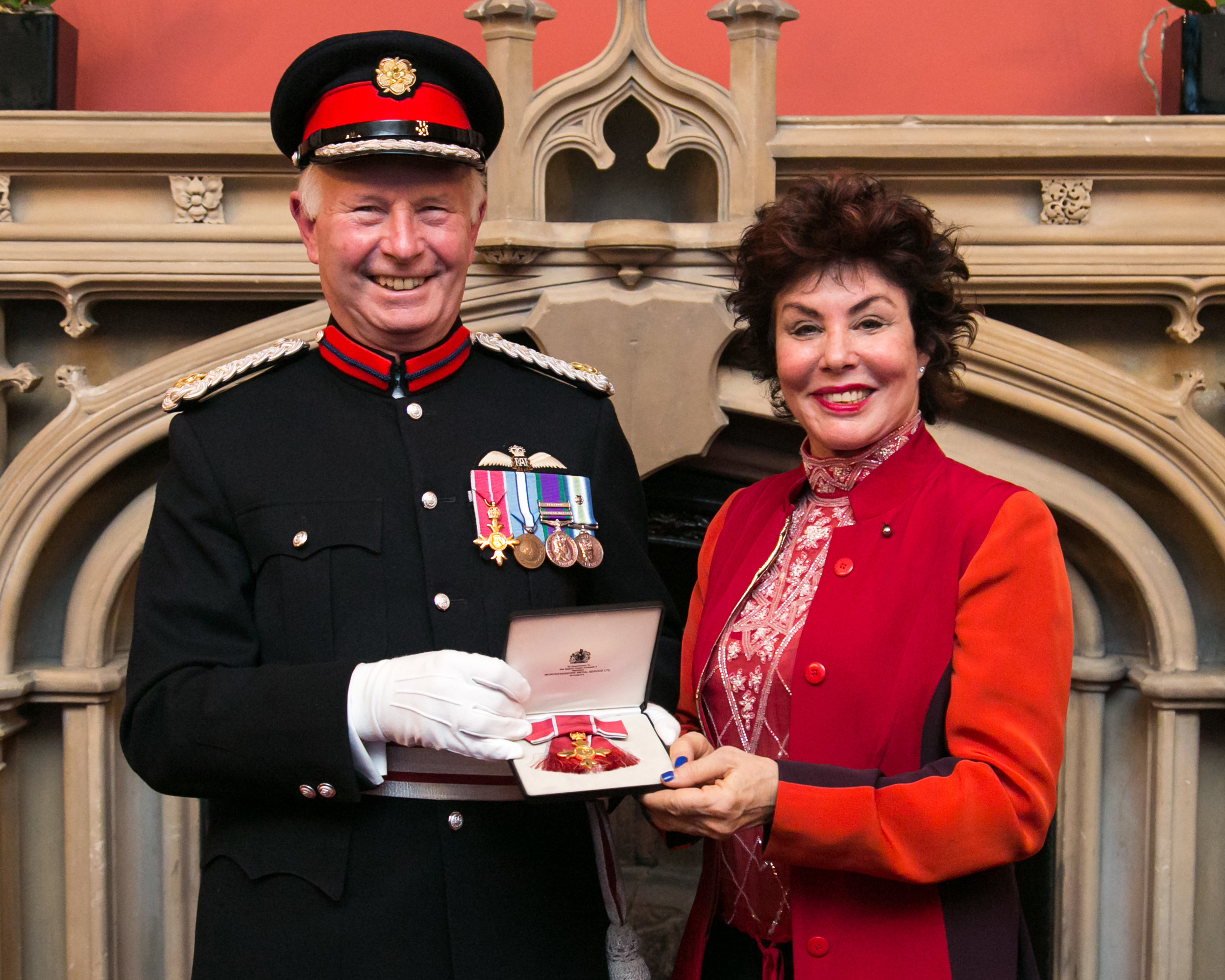 Ruby Wax receiving her OBE from Vice Lord-Lieutenant of Greater London, Mike Dudgeon