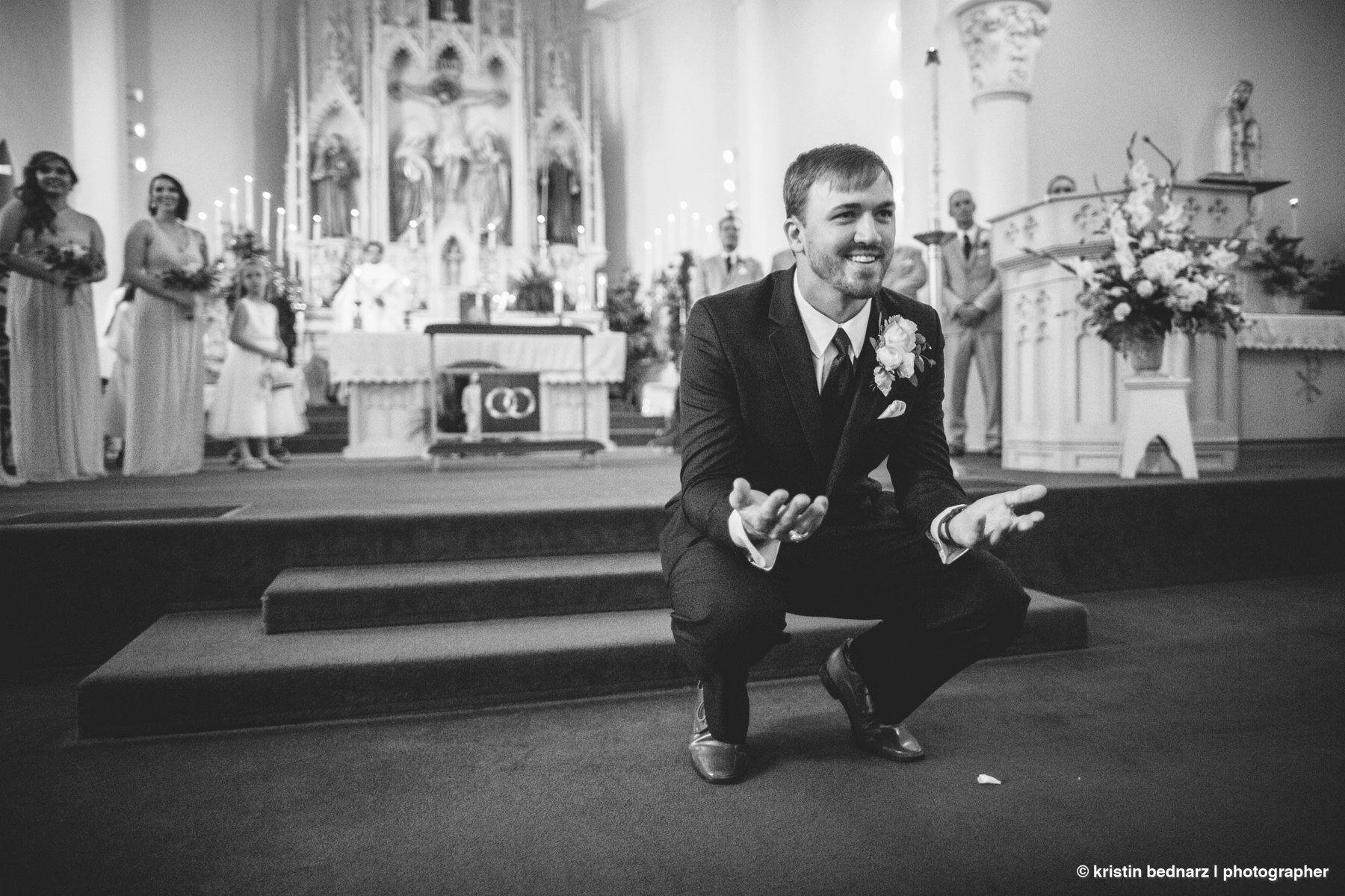 No, Callan was NOT bending down to catch his bride…