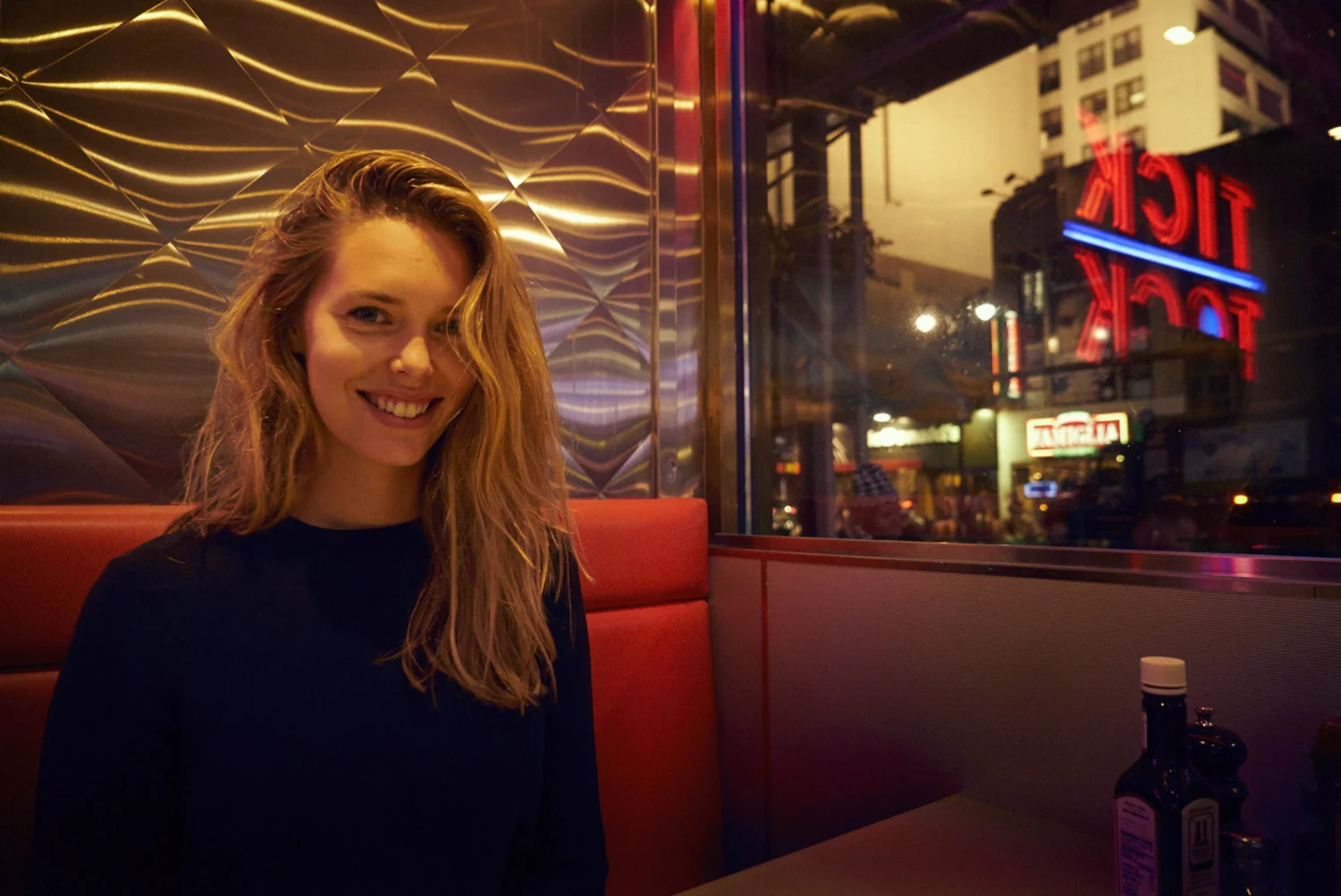 Girl smiling in Tick Tock Diner New York.jpg