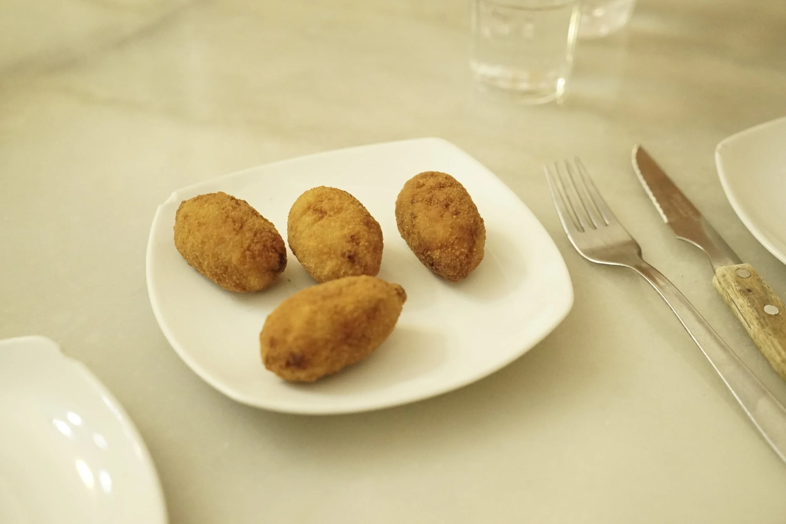 Croquettes on a white plate.jpg