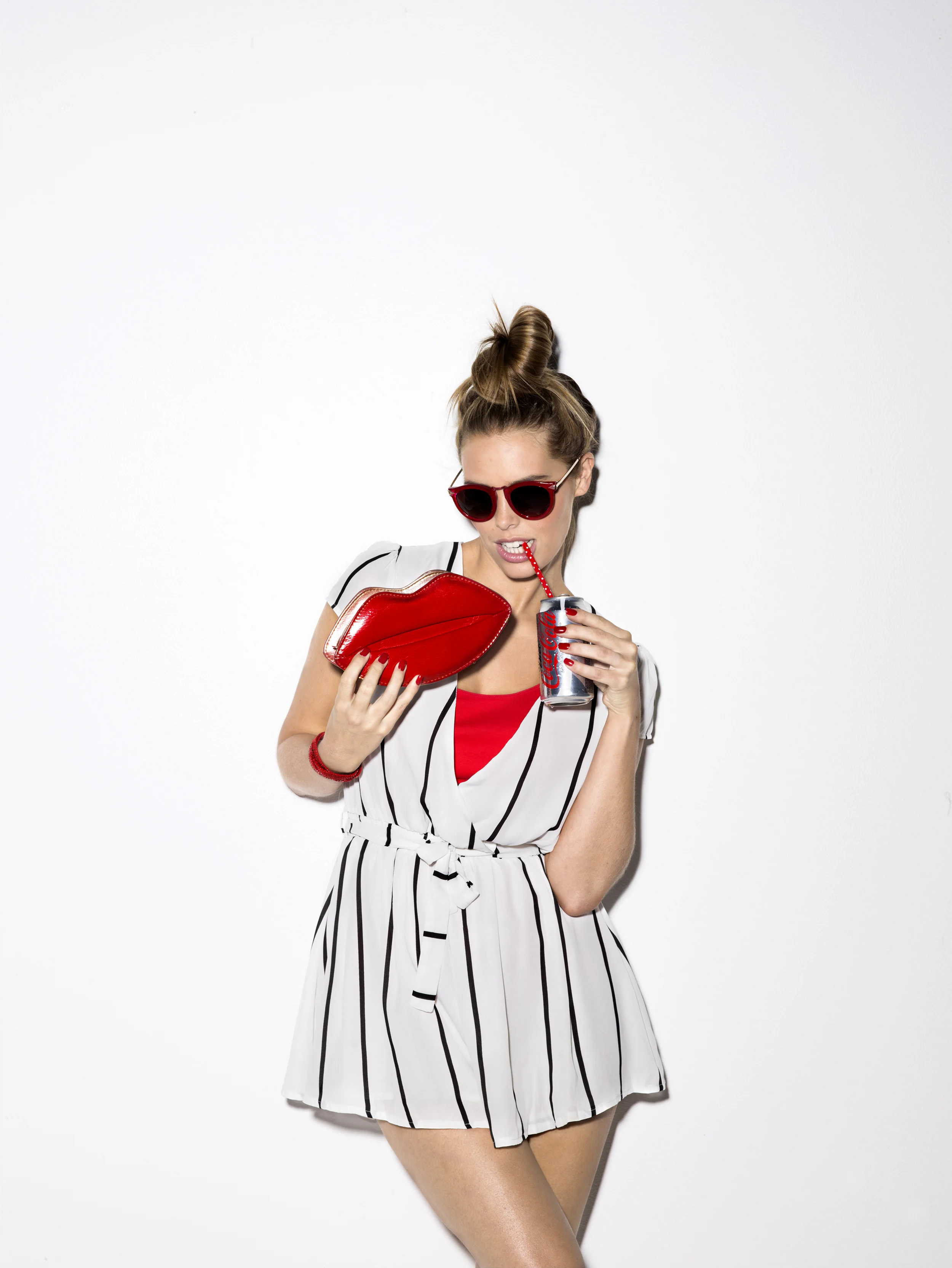 Girl drinking diet coke.