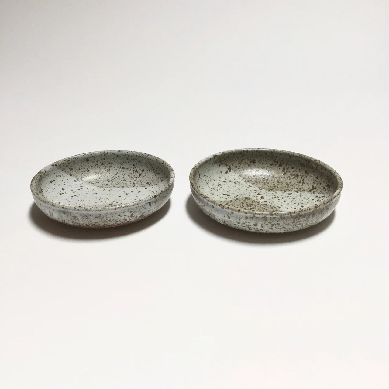 1071 Pair speckled low bowls side.jpg