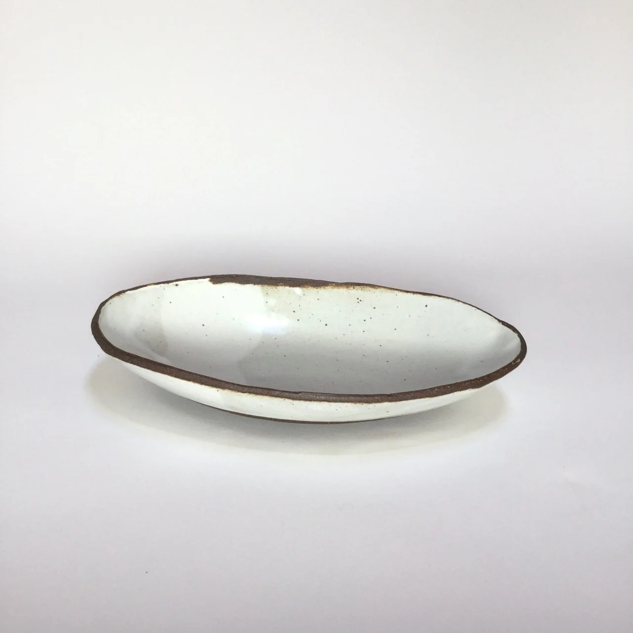 1090 Glossy white oval black rim side 1.jpg