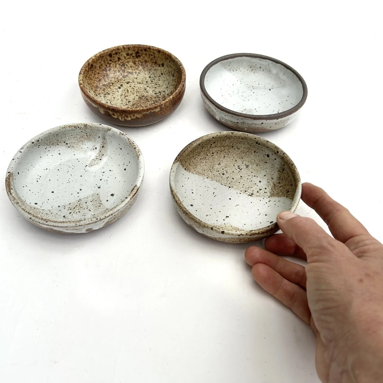 2703 Condiment bowls with hand.jpeg