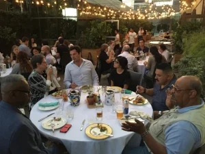 Participants, instructors and guests of the 2016 Institute enjoy some social time together, digesting the day!