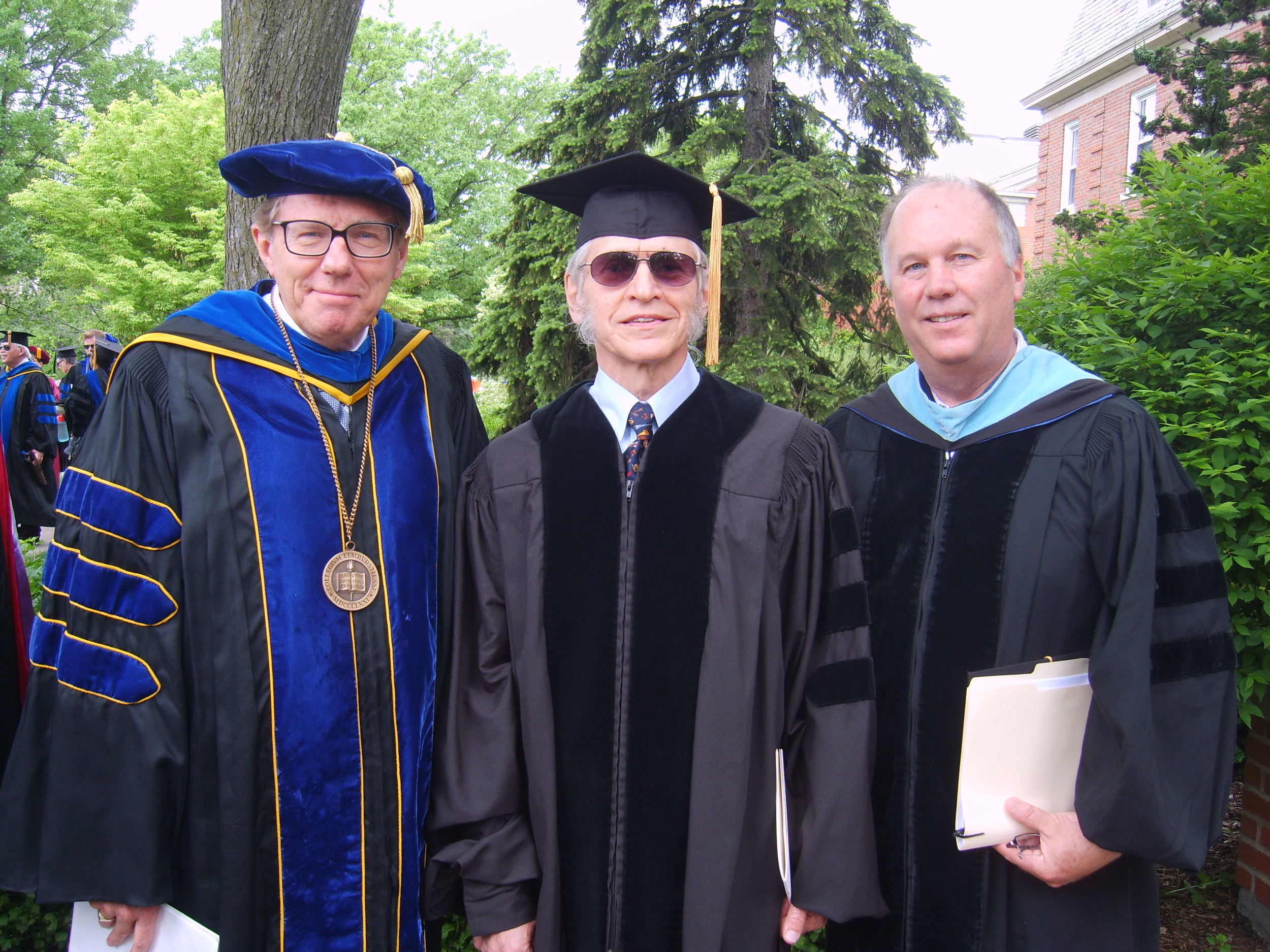 Fred Gretsch is flanked by Elmhurst College Interim President Larry Braskamp (left) and Music Department Chair Peter Griffin.
