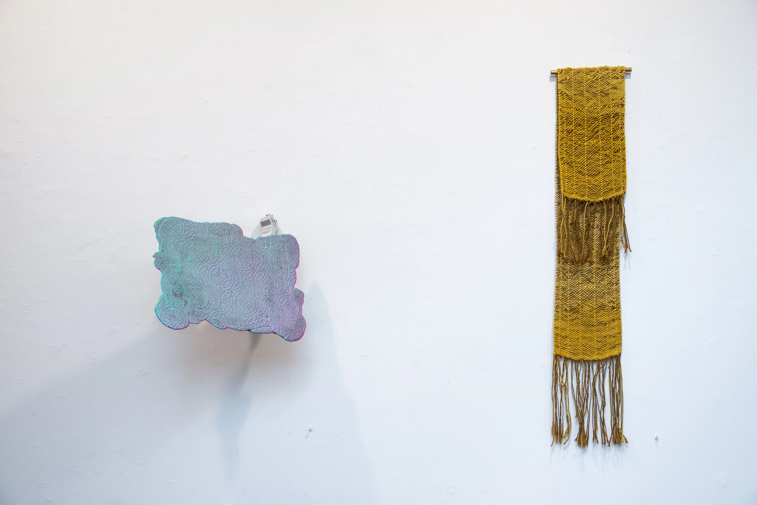 Left: Spray Cement, acrylic paint, spray paint, wire mesh, sprayer and dip tube, towel hook. 13"x14"x12" 2017 Right: Textiles by Megan Mesloh Photo Credit: Jason Horvath