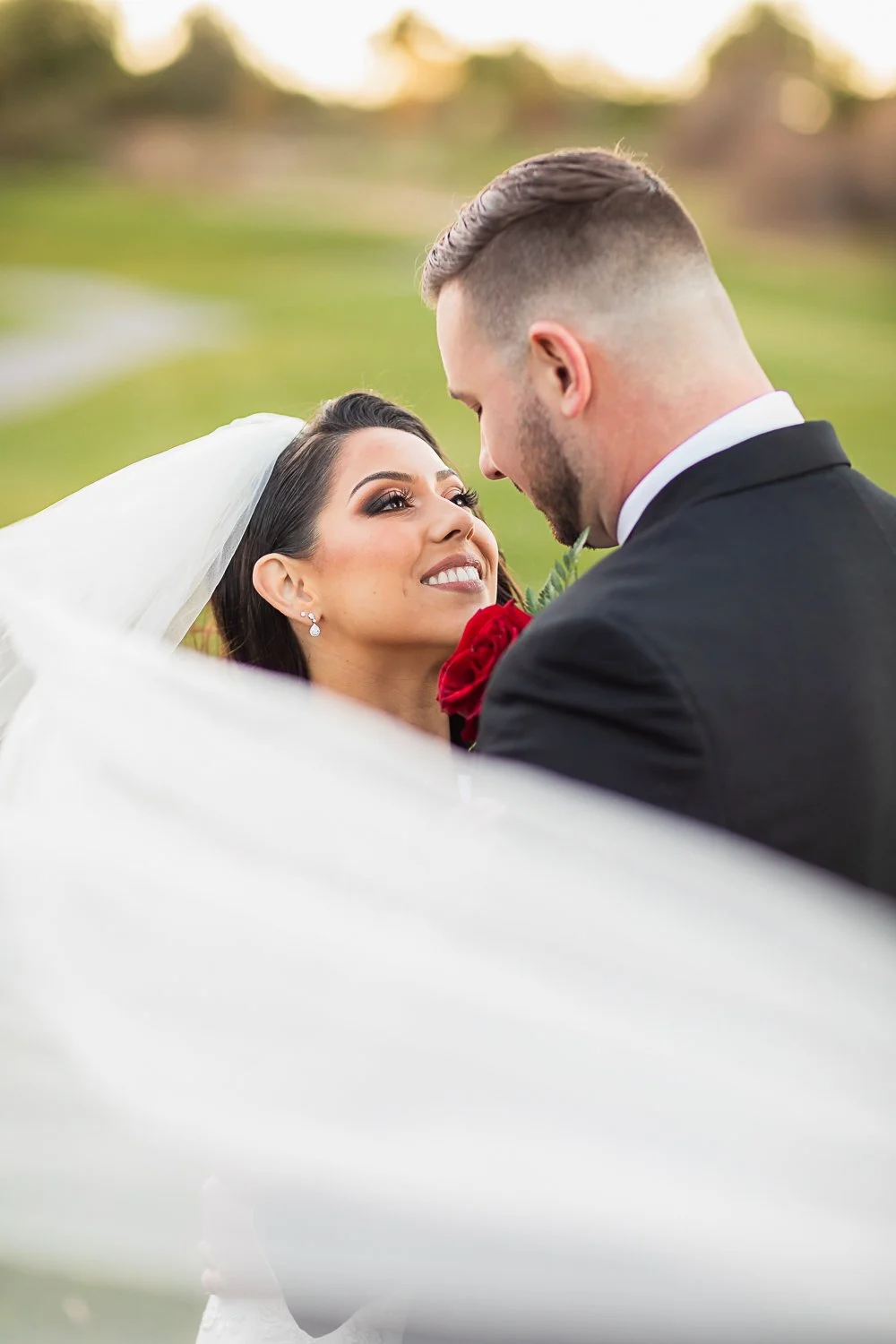 Veil shot with bride and groom
