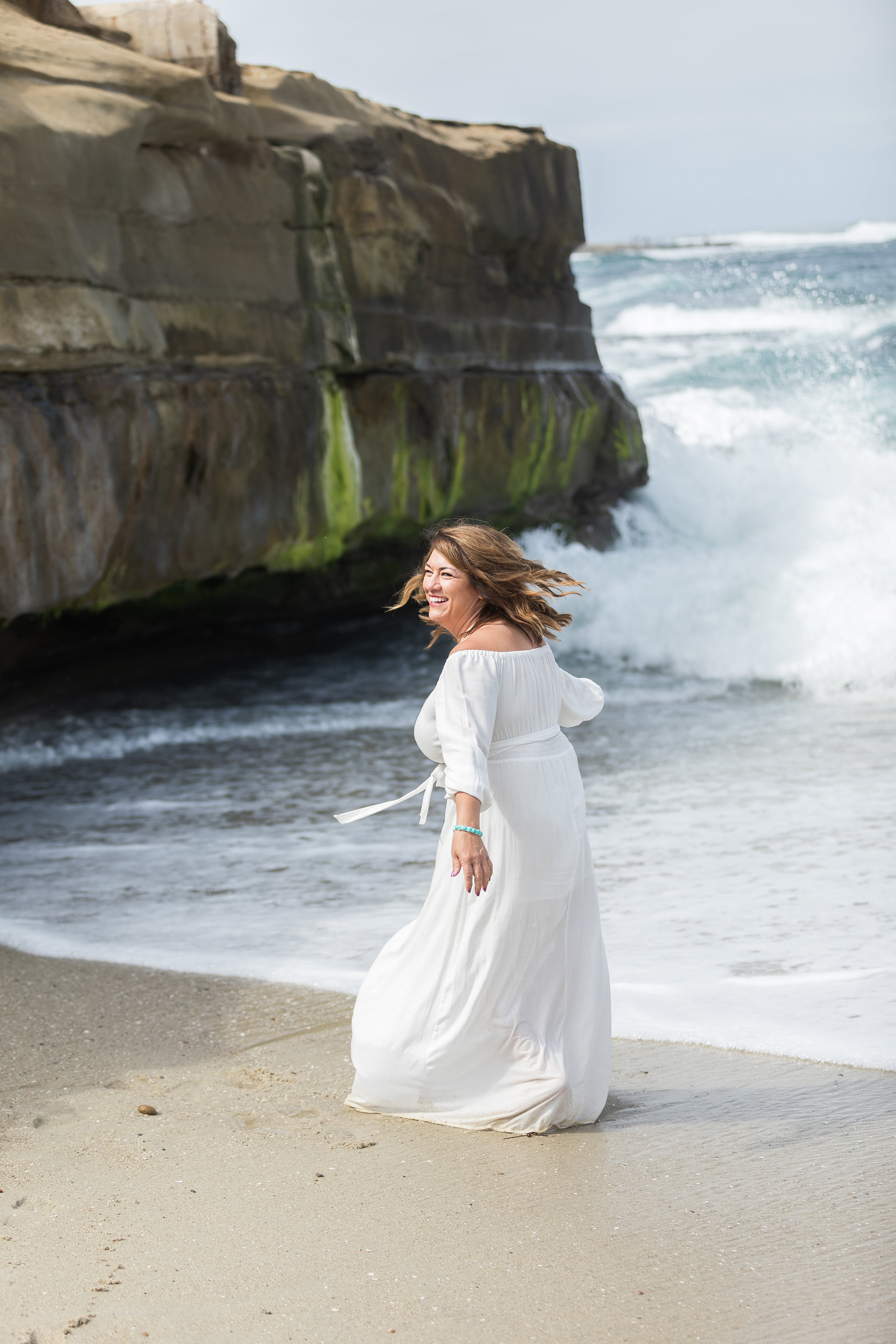 Mom playing in the ocean with long white dress.jpg
