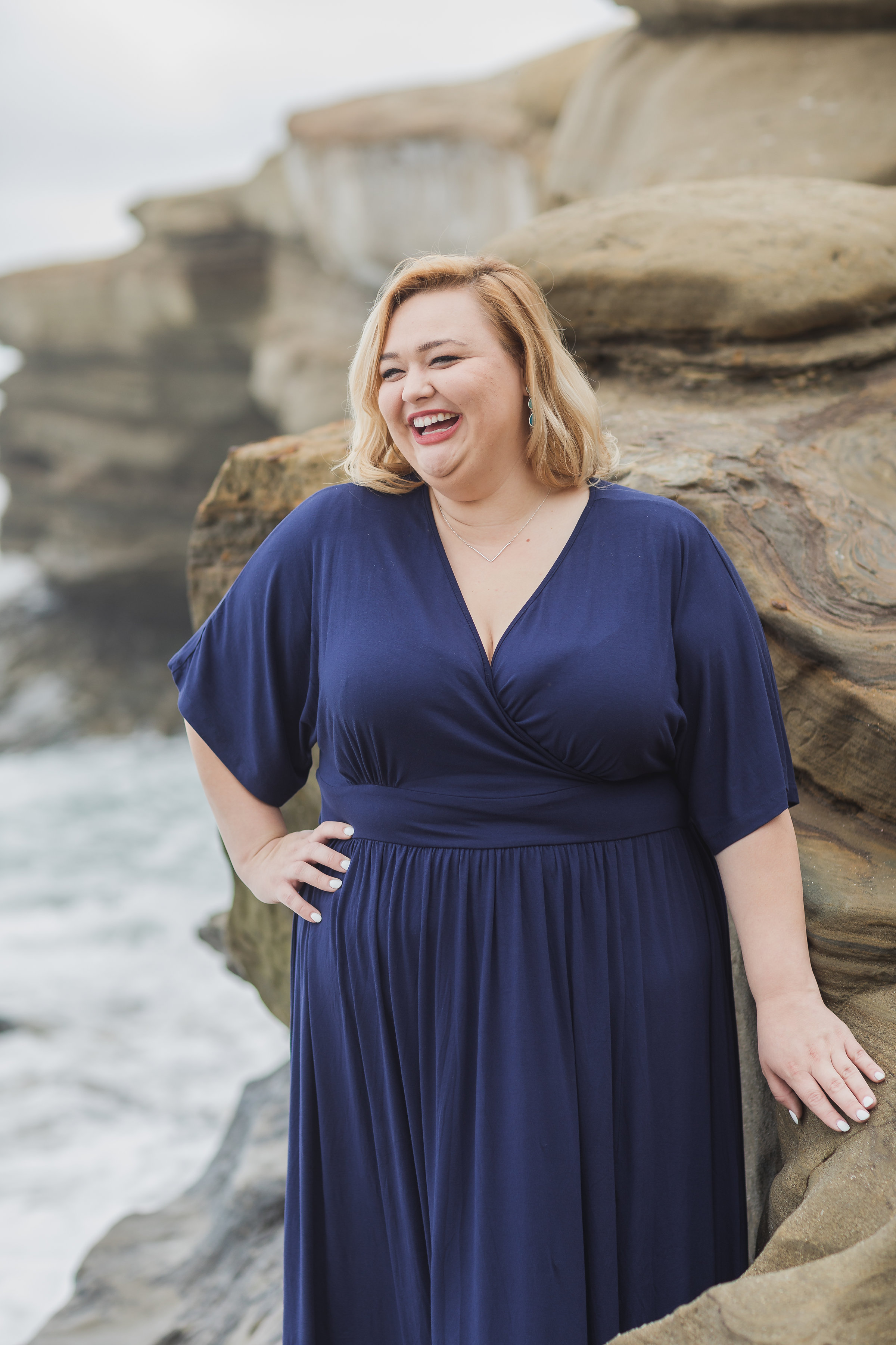Laughing gal in blue dress and the beach.jpg