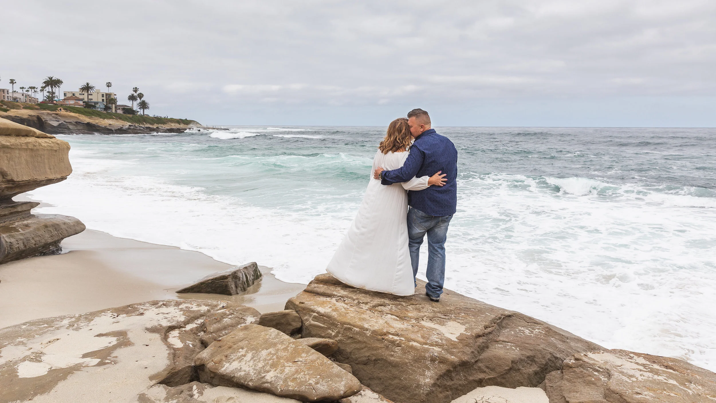 Husband and wife looking out to sea.jpg