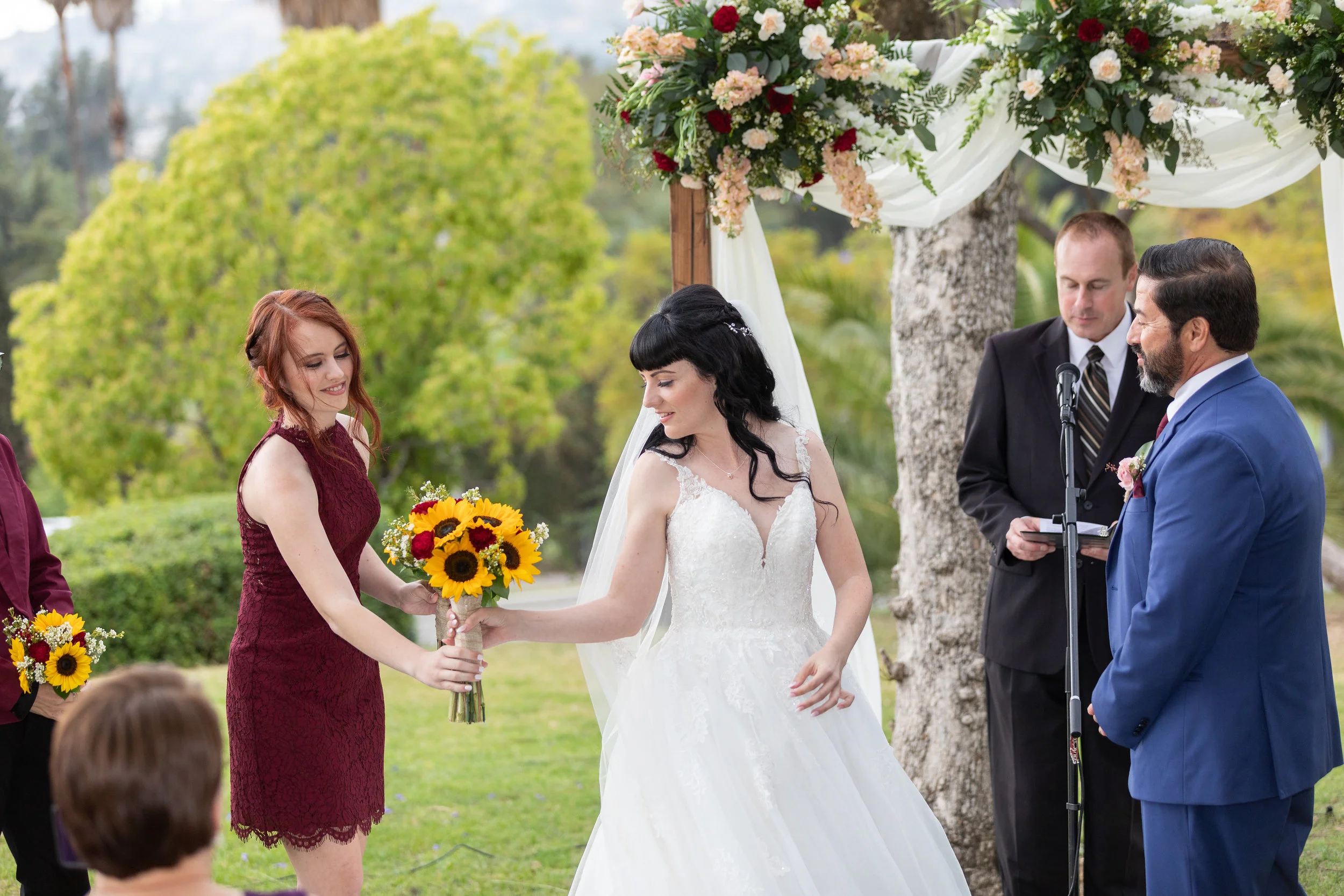 Photo of Bride passing bouquet to Maid of Honor.jpg