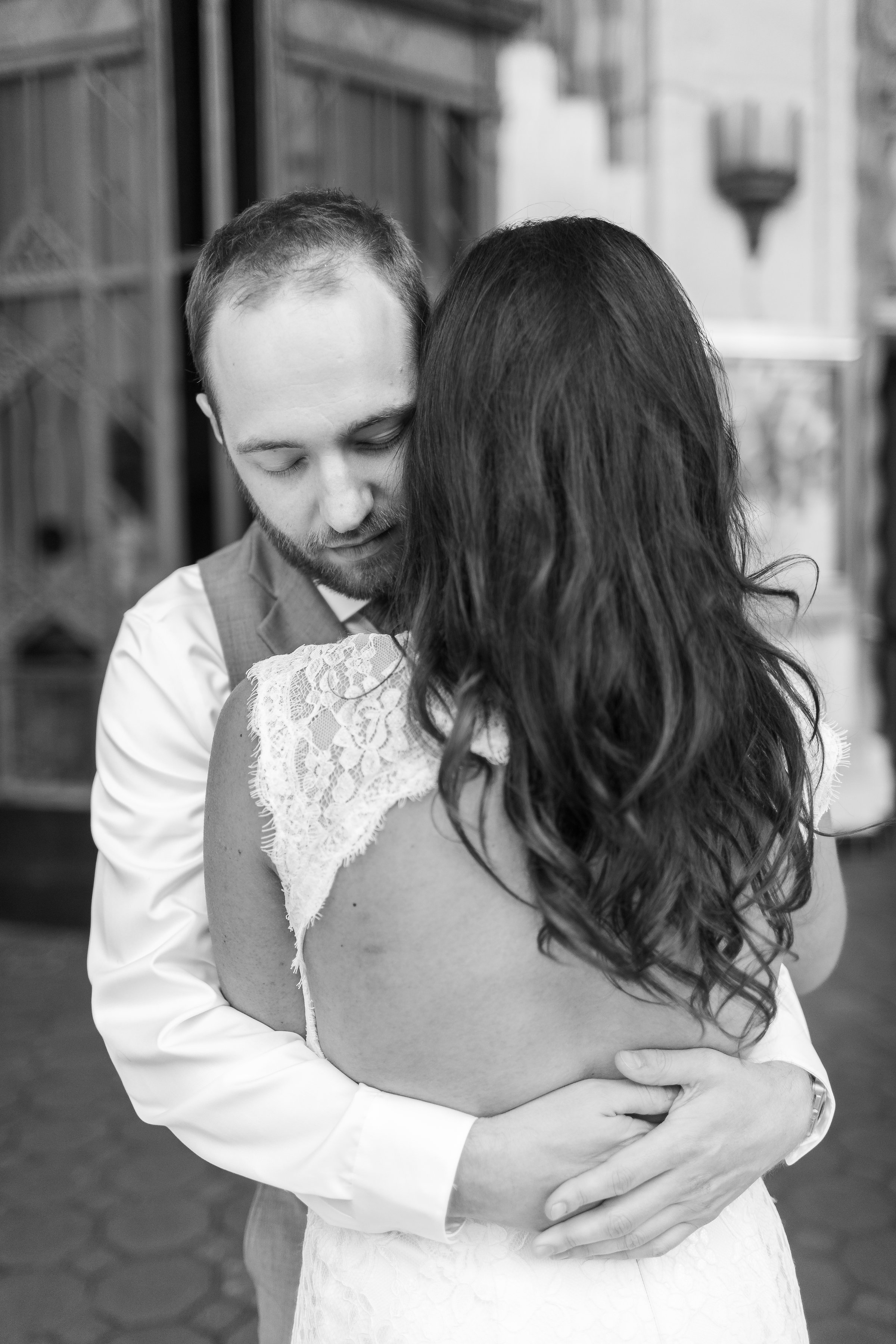 Photo of Bride and Groom hugging in black and white.jpg