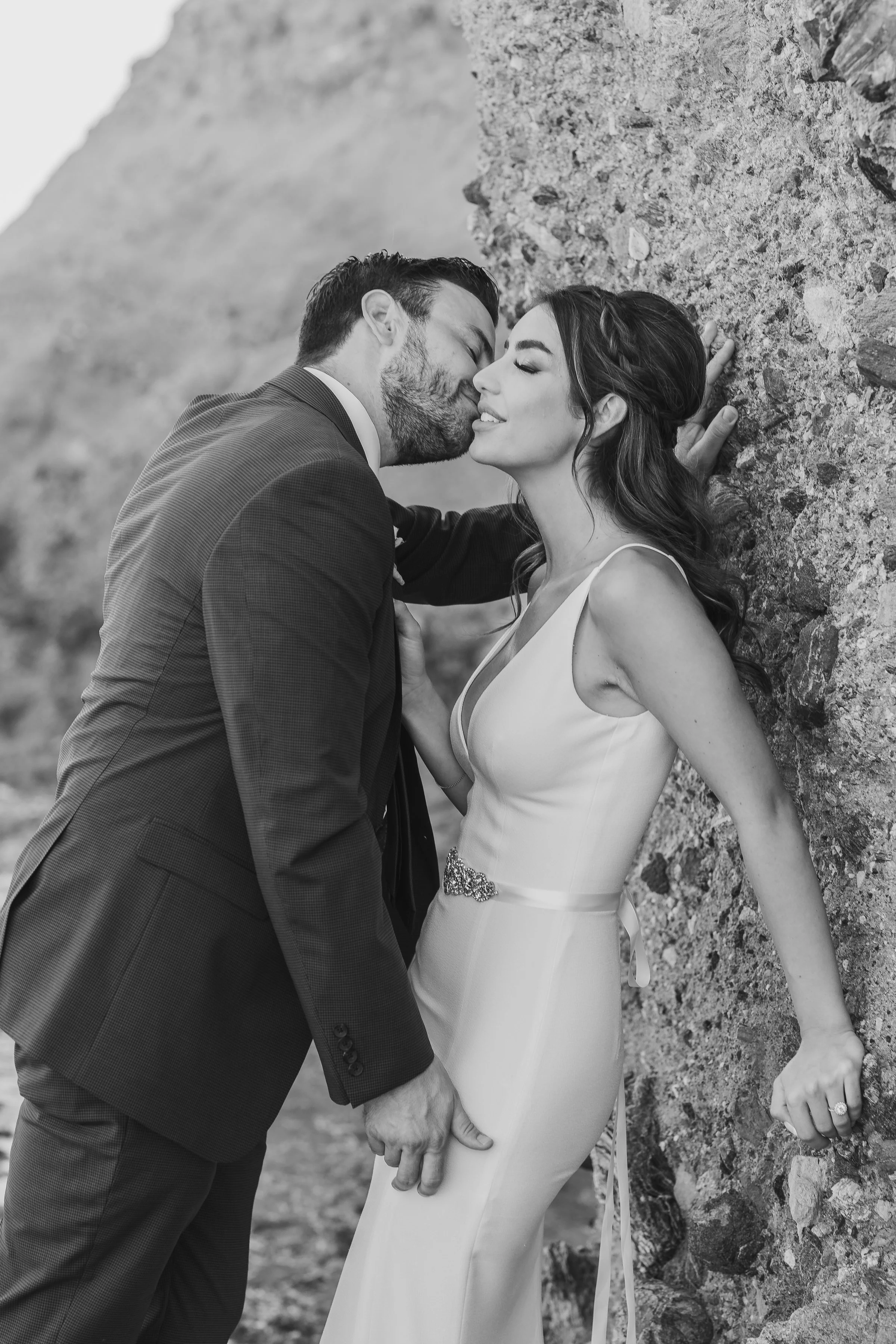 Romantic Photo of Wedding Couple on the rocky shores of Treasure Island Laguna Beach.jpg