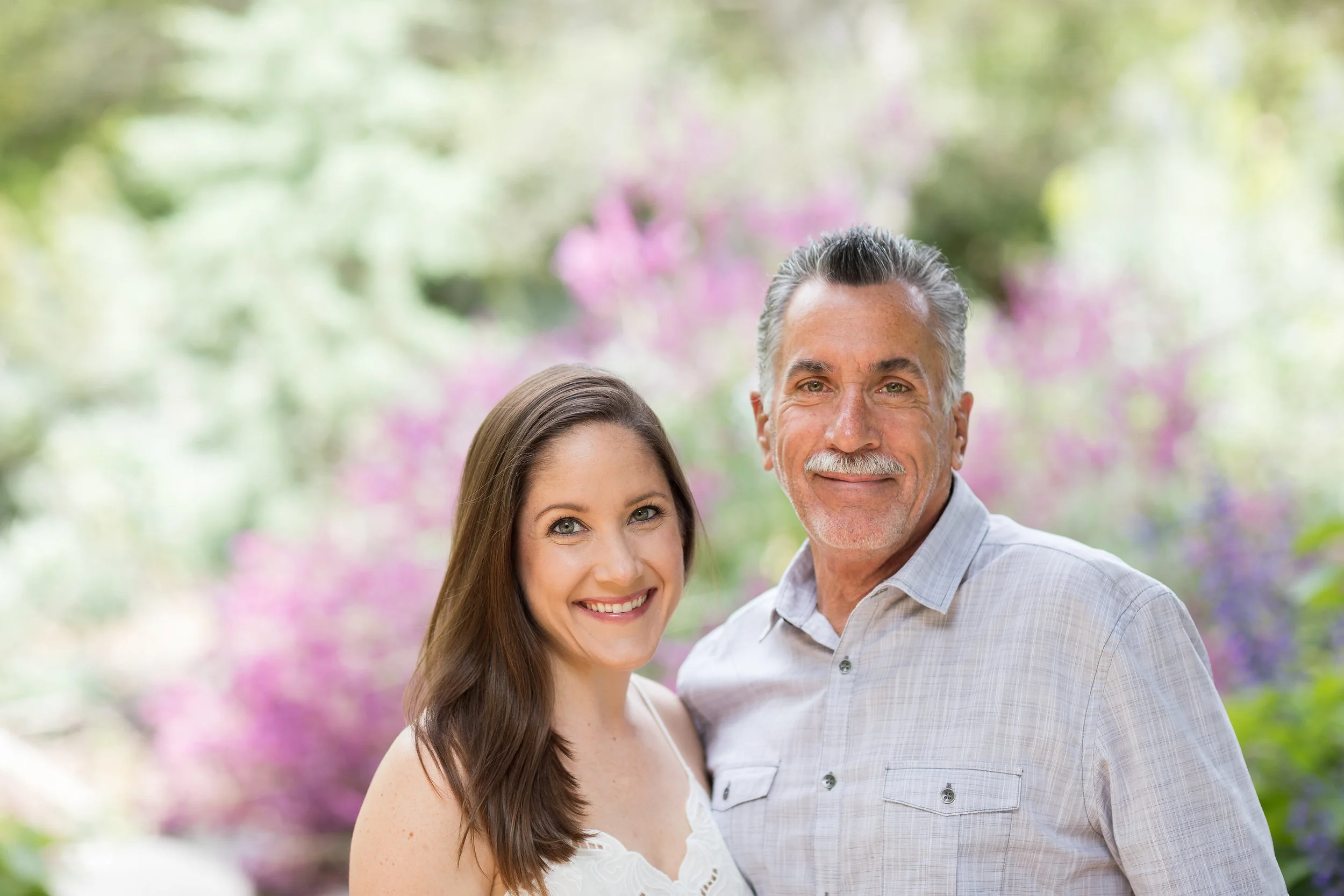 HB Photo of Father and adult daughter in front of garden.jpg