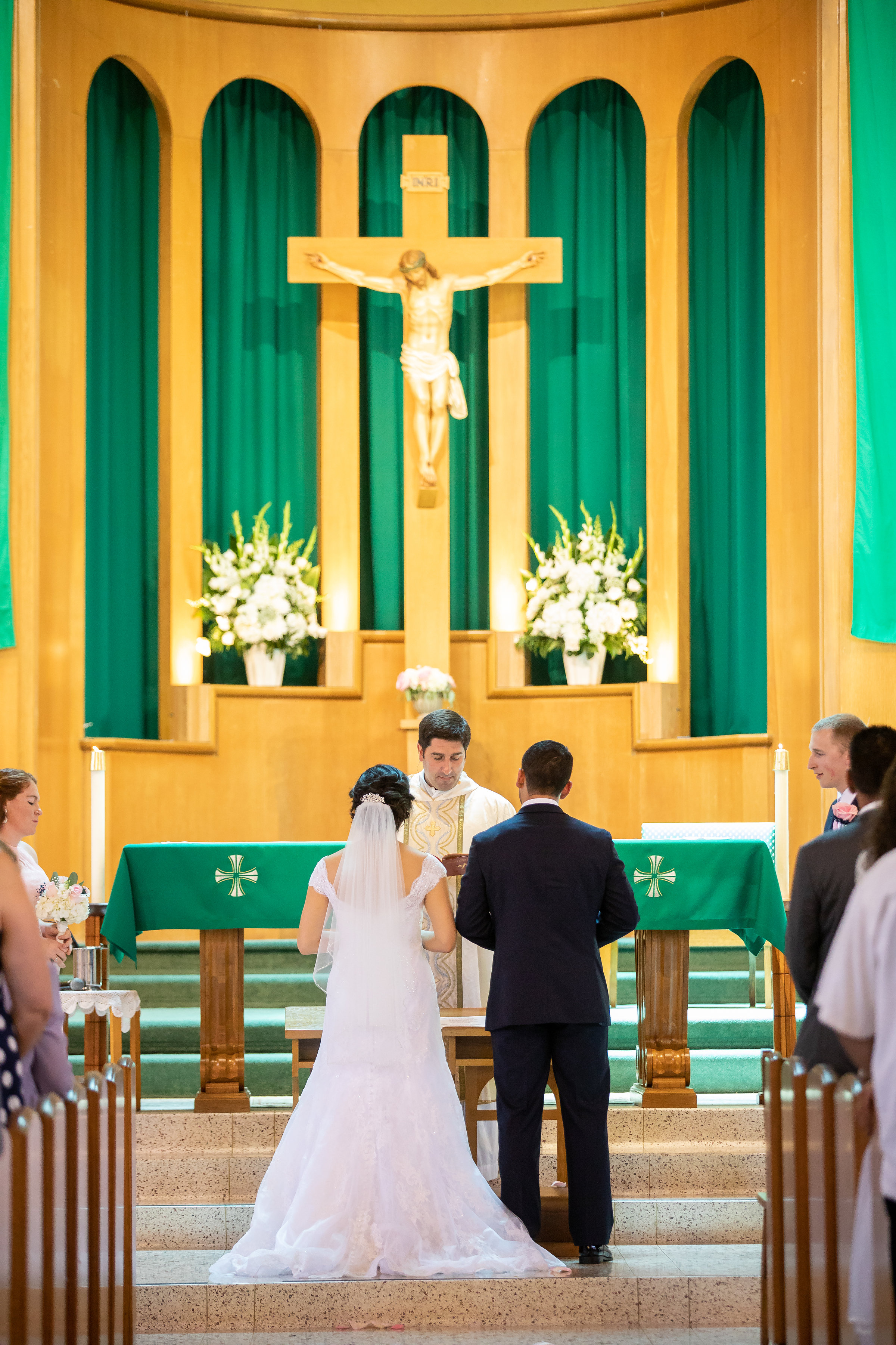 ! Photo of the Bride and Groom in front of the Church alter.jpg
