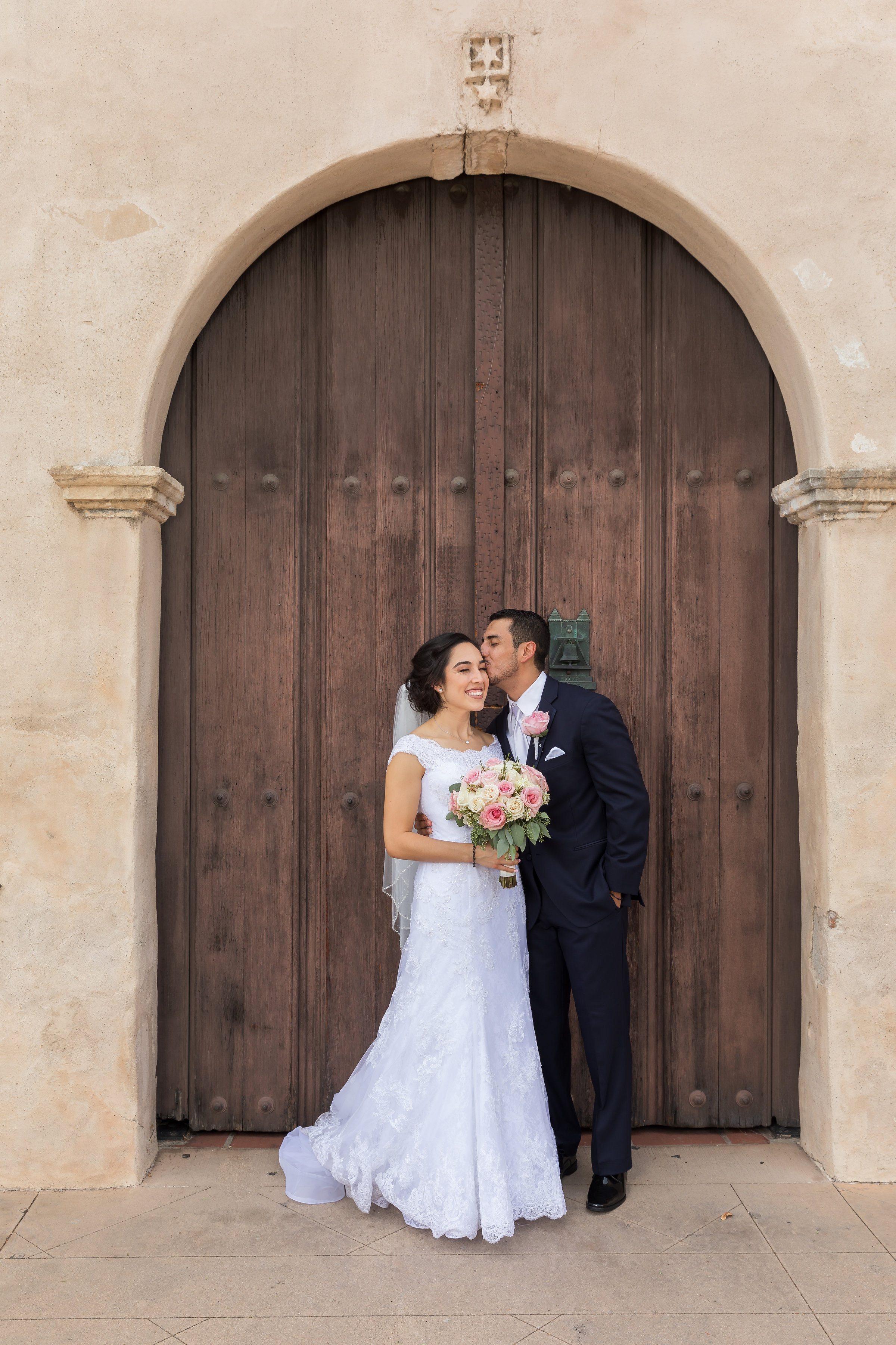 ! Playful Kiss in front of San Gabriel Mission.jpg