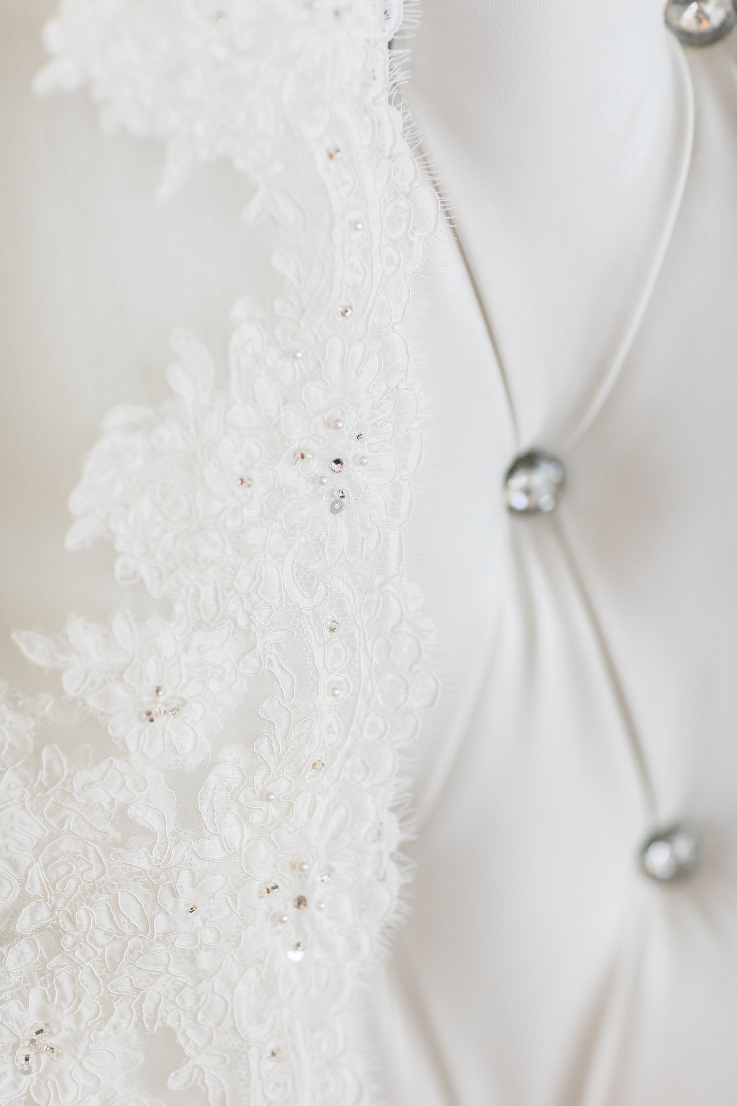 Photo of Luxury Wedding Veil on a King and Queen White Chair.jpg