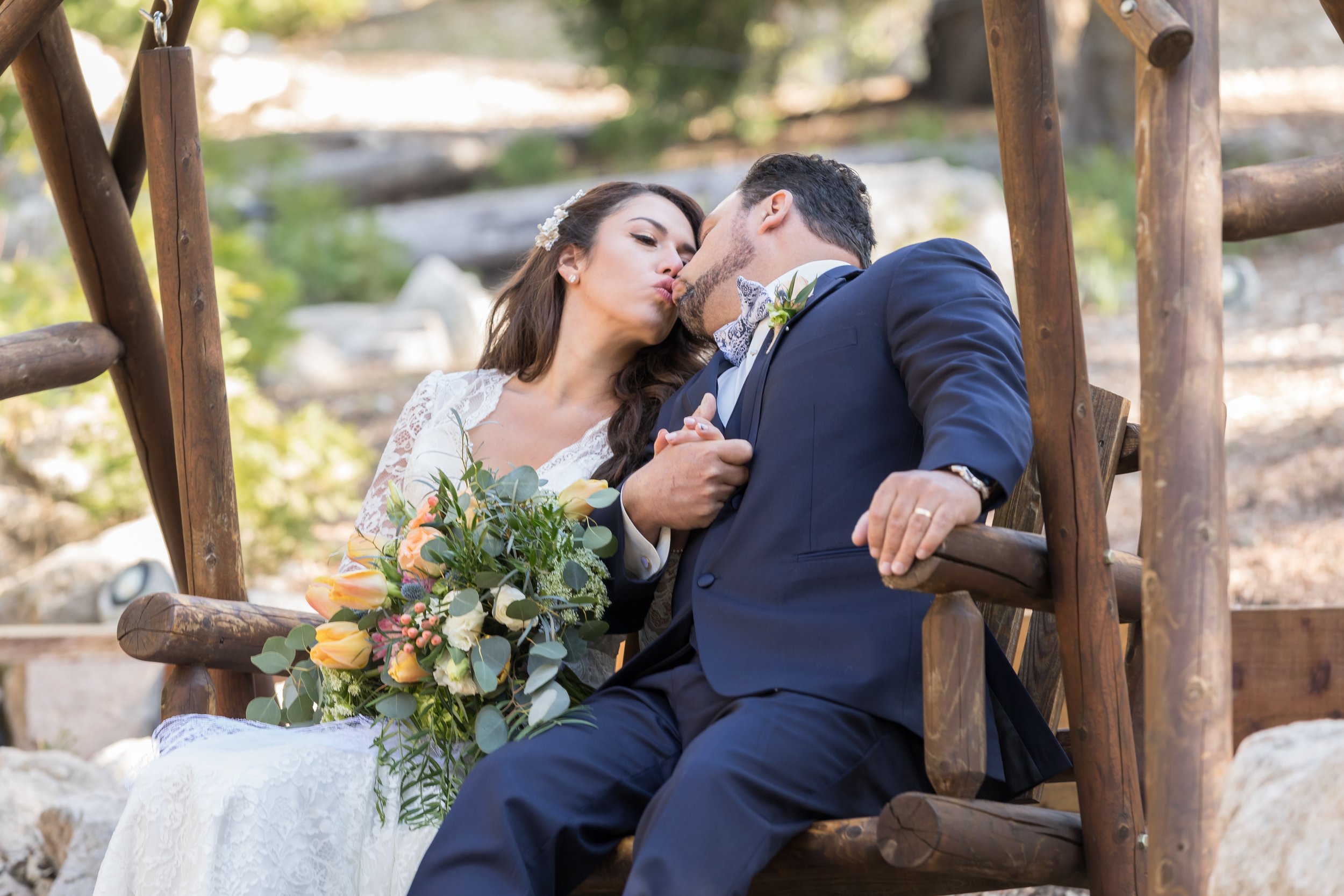 ! Rustic Wedding Photography Kissing on the Swings.jpg
