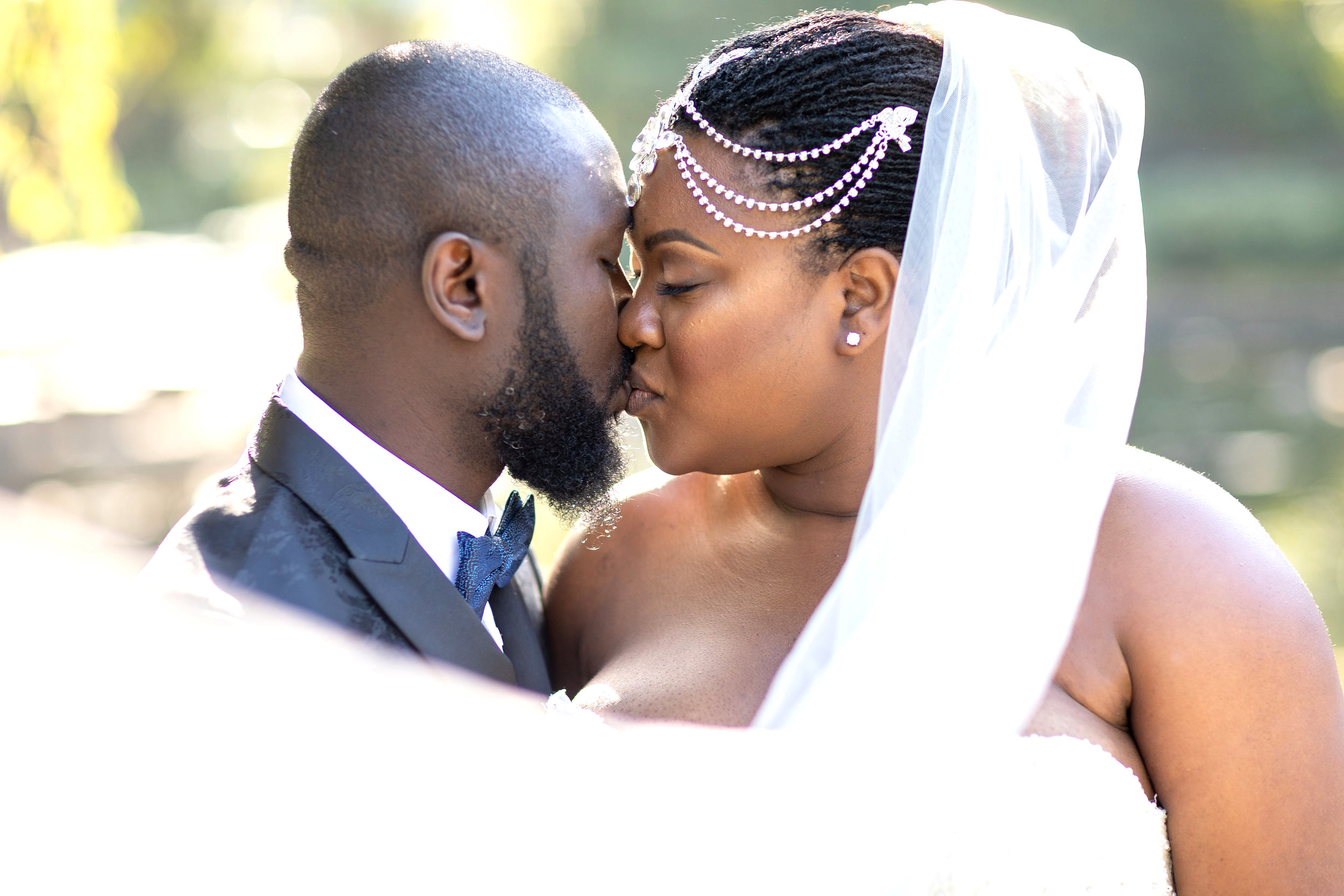 Bride and Groom wrapped in veil at LB Japanese Gardens.jpg