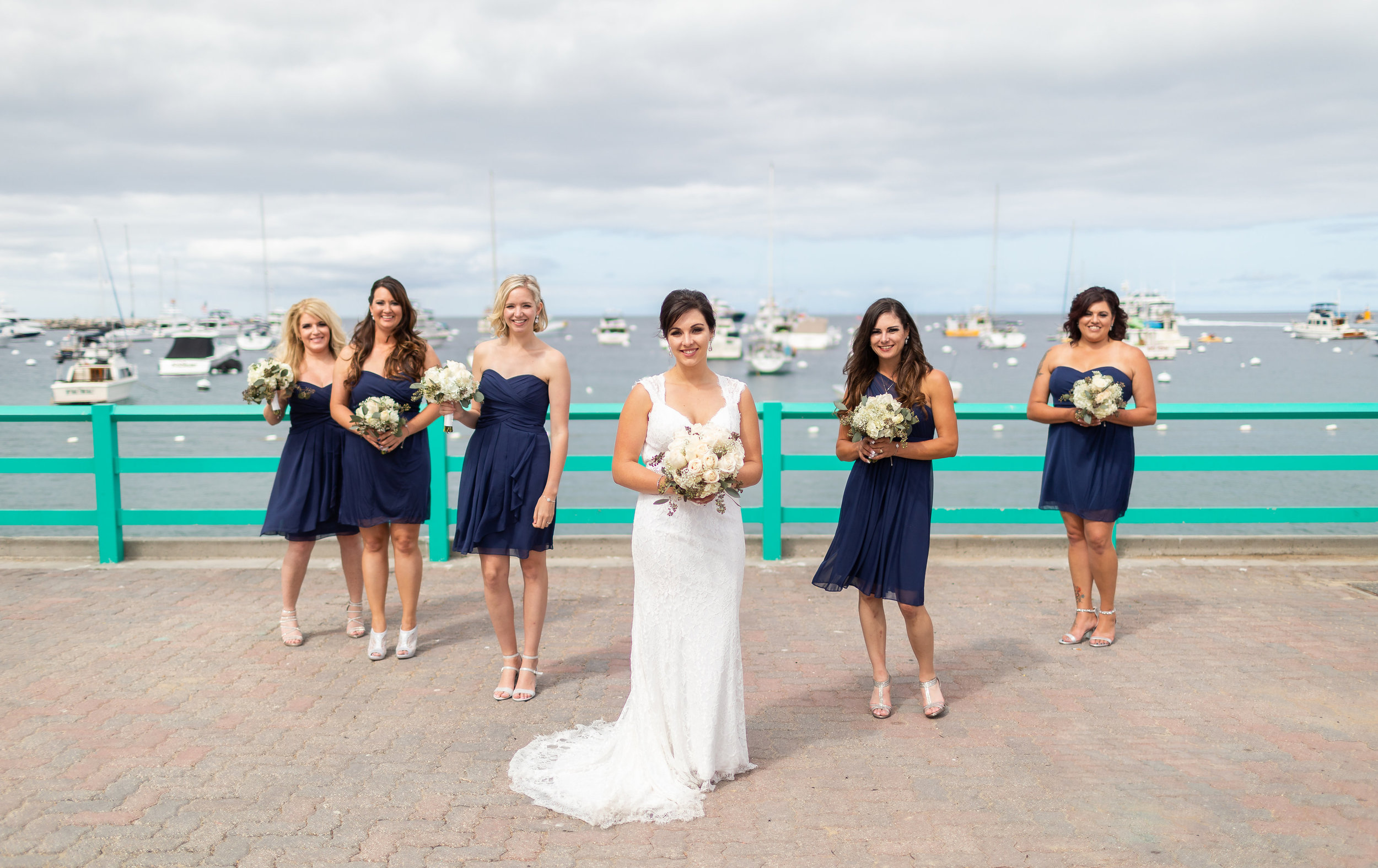 Bridesmaids in Blue Photo Pose with Bride.jpg
