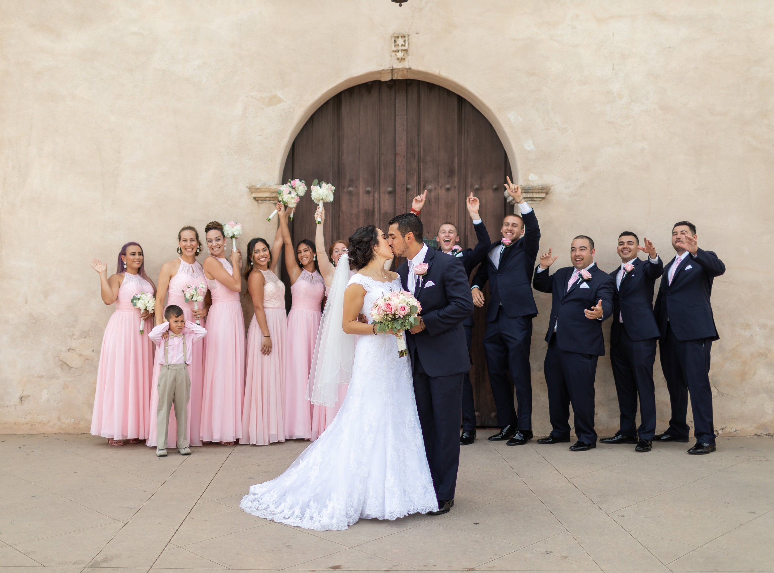 ! Fun Wedding Party Photo with Couple Kissing.jpg