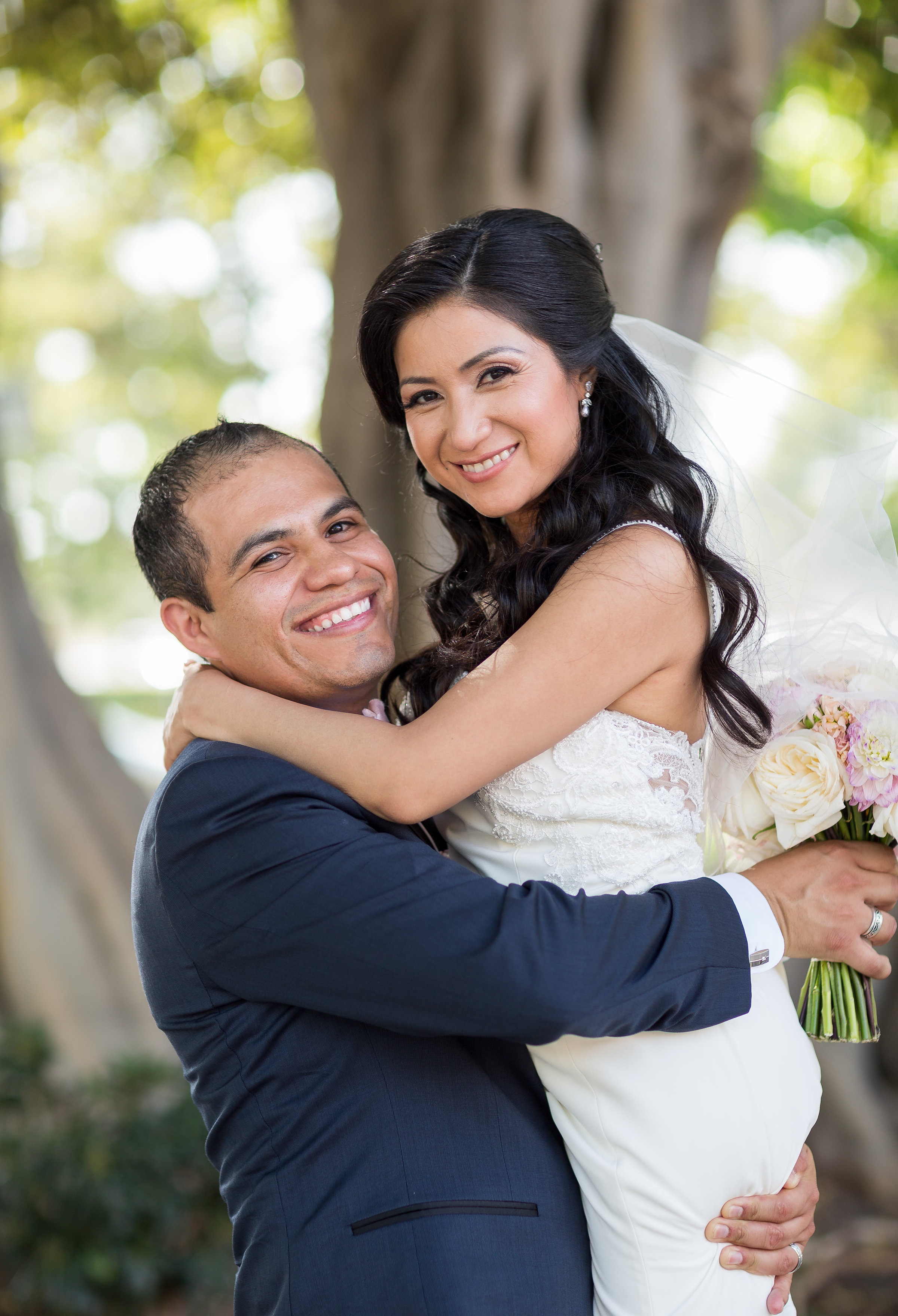 Photo of Happy Groom Lifting Happy Bride.jpg