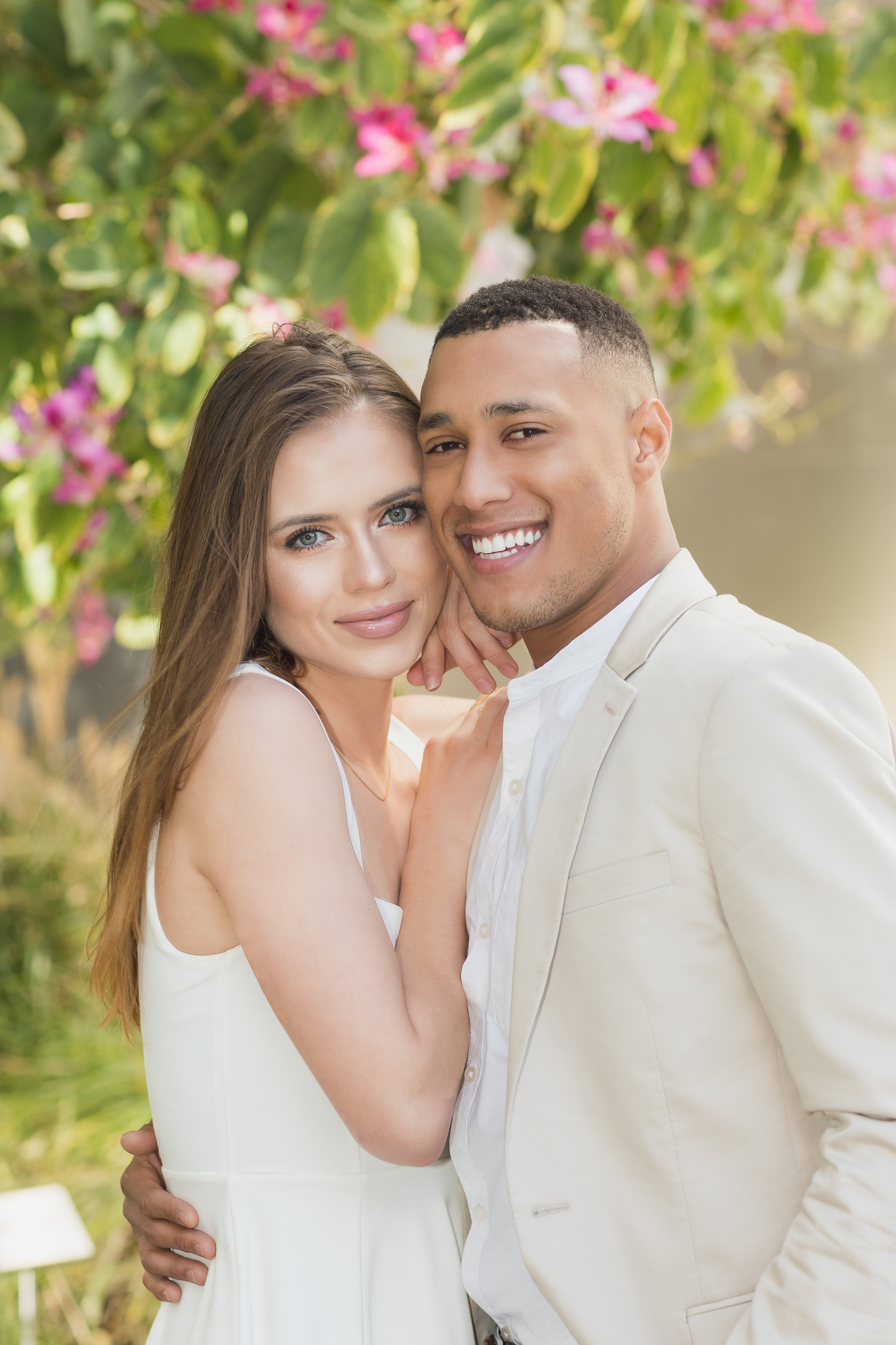 Beautiful couple surrounded by flowers for LA Engagement Photo Shoot.jpg