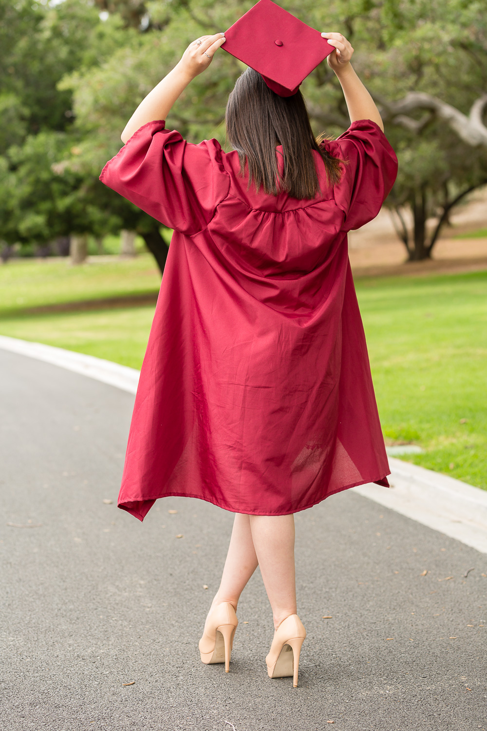 Senior graduate in cap and gown.jpg