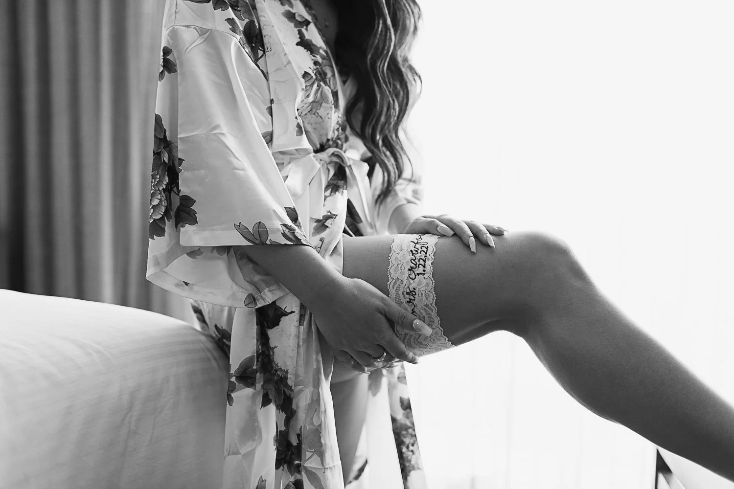 Bride putting on garter
