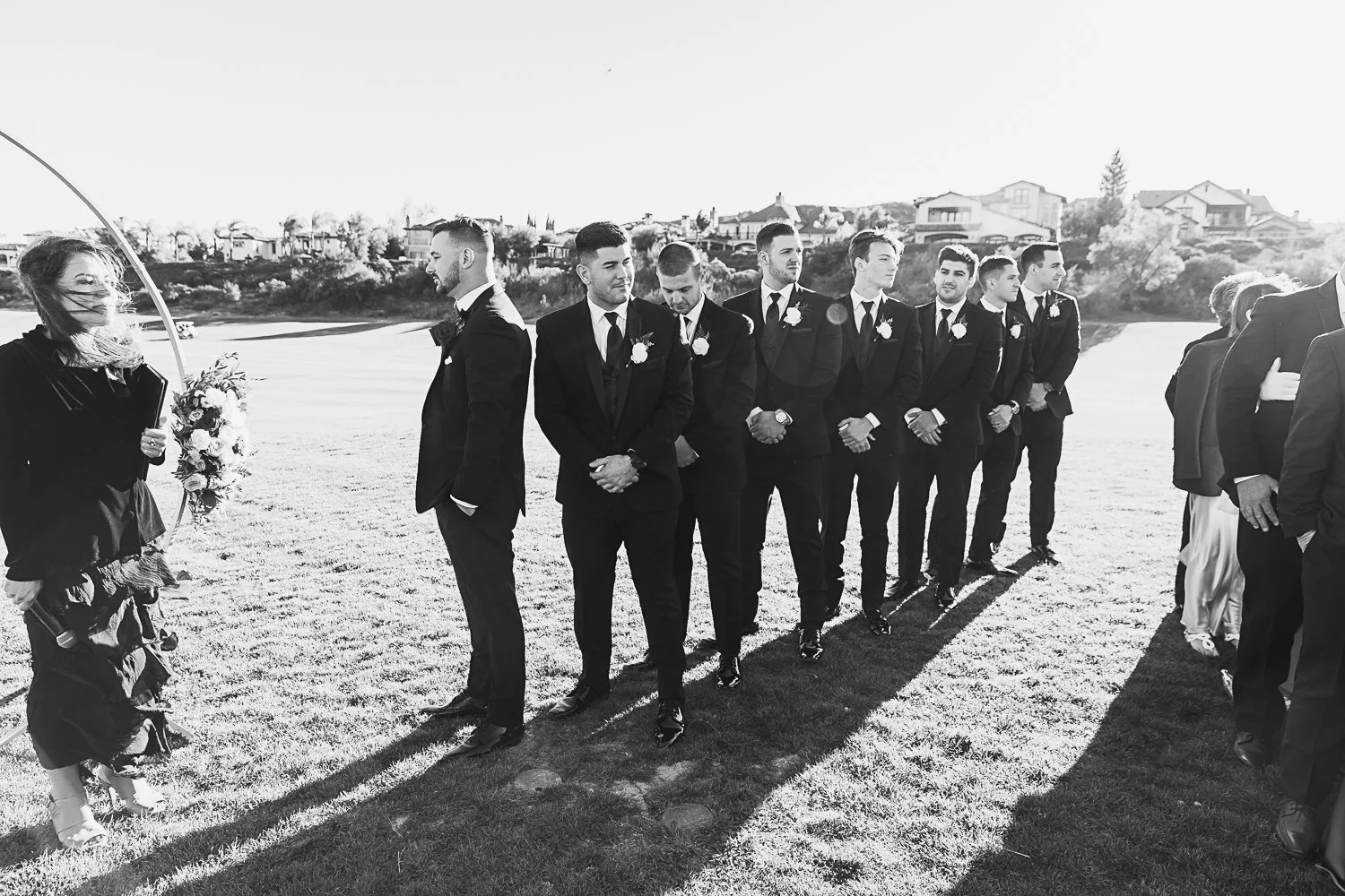 Groom and groomsmen awaiting bride