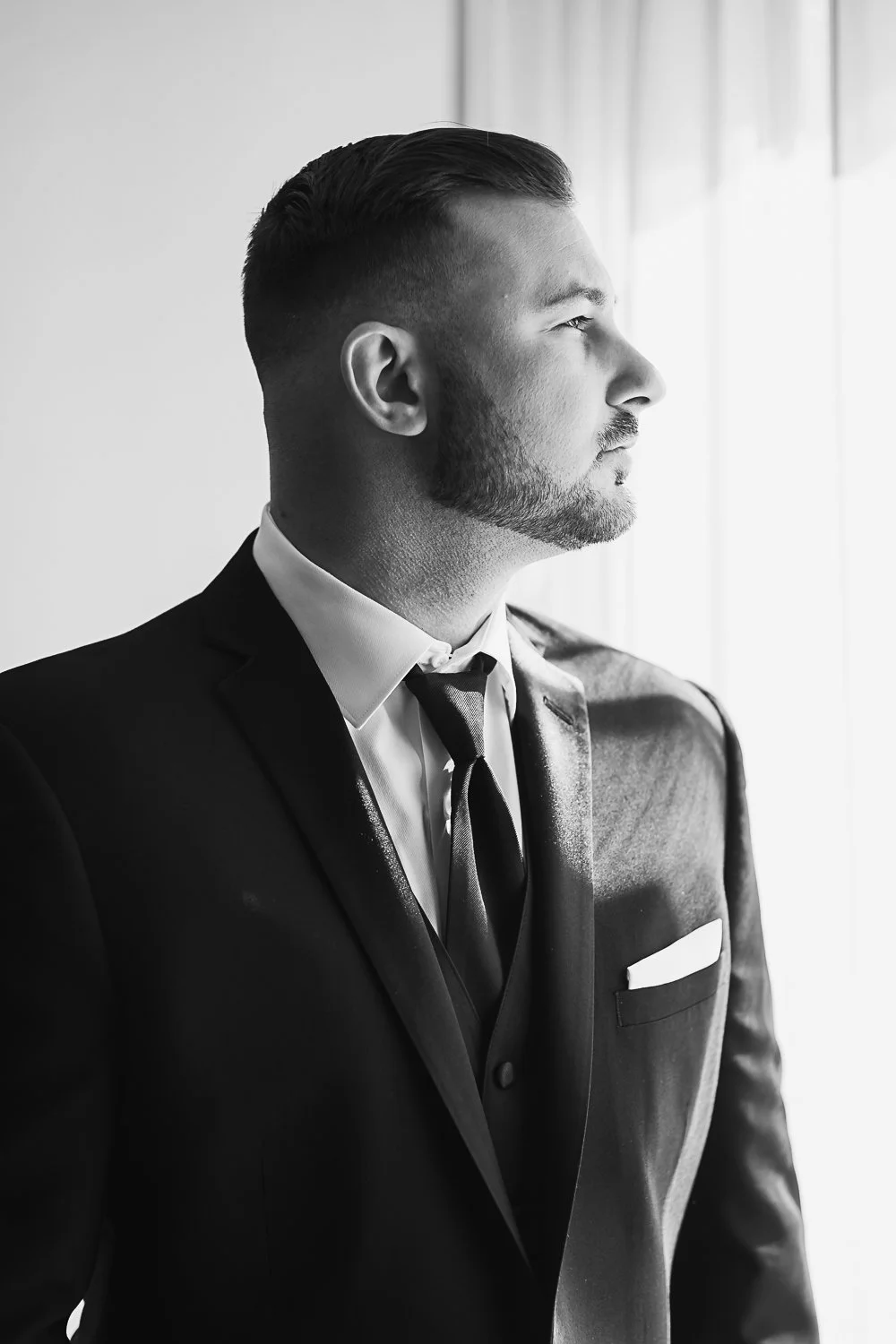 Groom by window