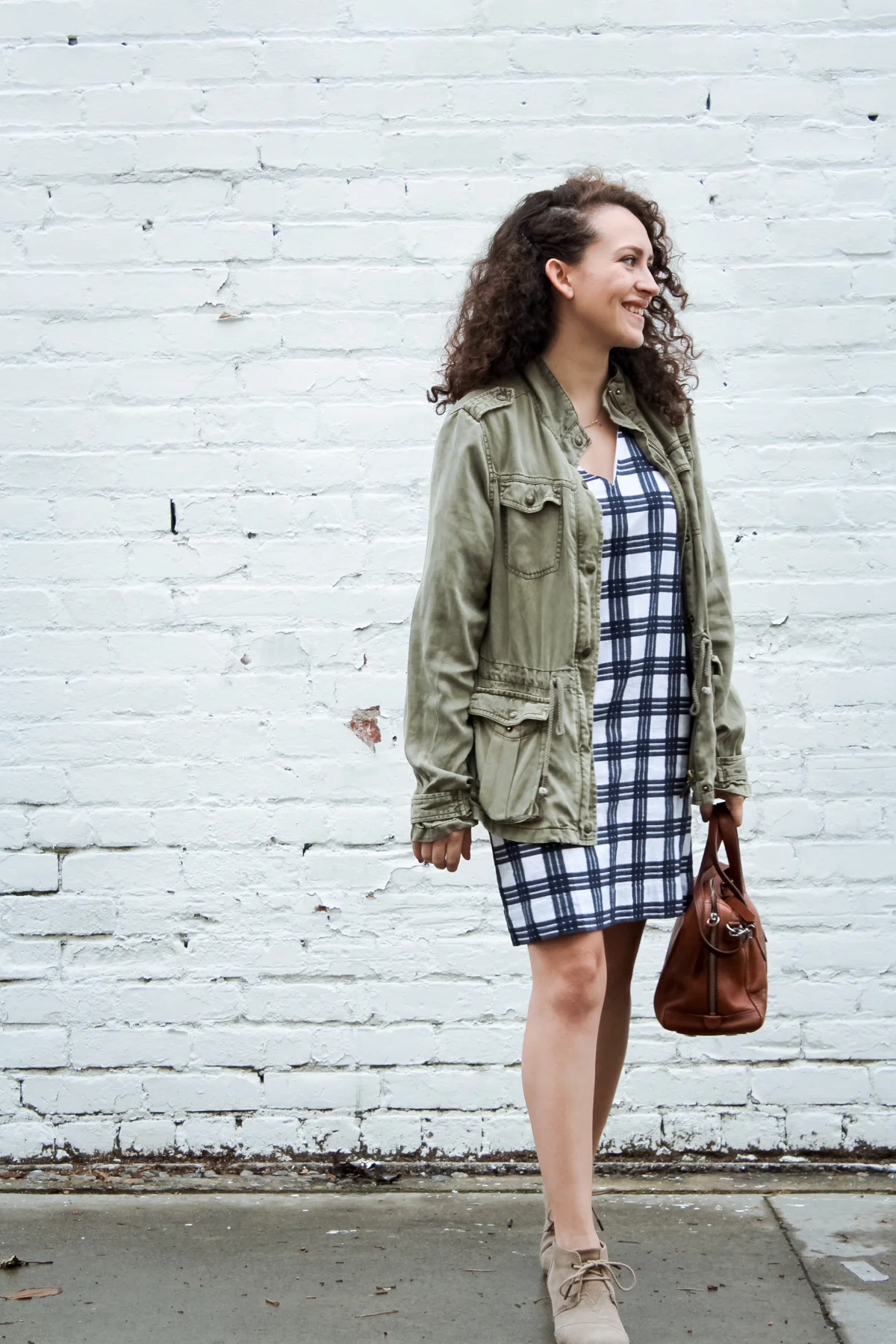 my look for day 10 of the spring 10x10/unfancy remix challenge is a rule breaker. a bell sleeve windowpane shift dress from madewell paired with a light olive green jacket, suede wedge heels from TOMS and a leather satchel bag from Fossil | tintedgreen