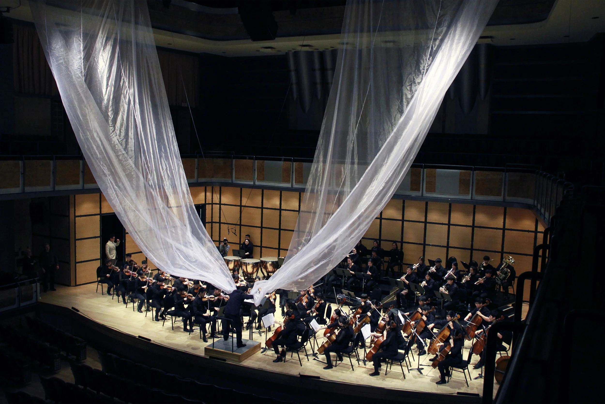  Photo Documentation. 2015.  Polyester White Fabric, 76 Musicians  Full Running Time: 8min.  Fabric Installation: 36ft x 18ft and 43ft x 18ft. 