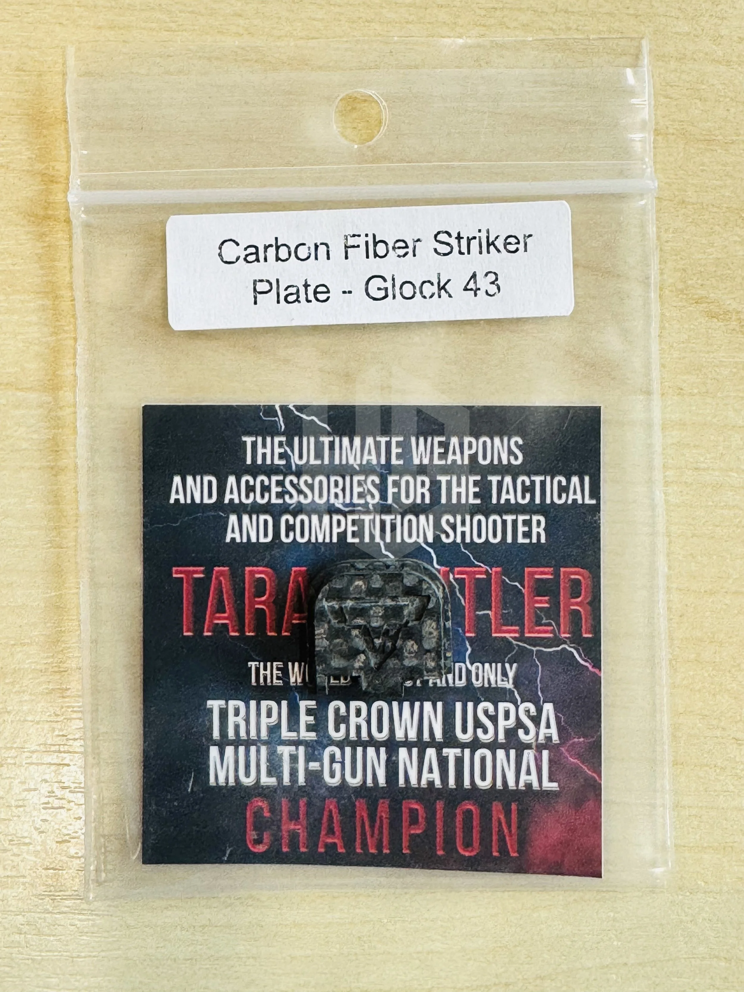 TTI Carbon Fiber Striker Plate สำหรับ Glock 43 ในถุงบรรจุภัณฑ์พร้อมฉลากสินค้า