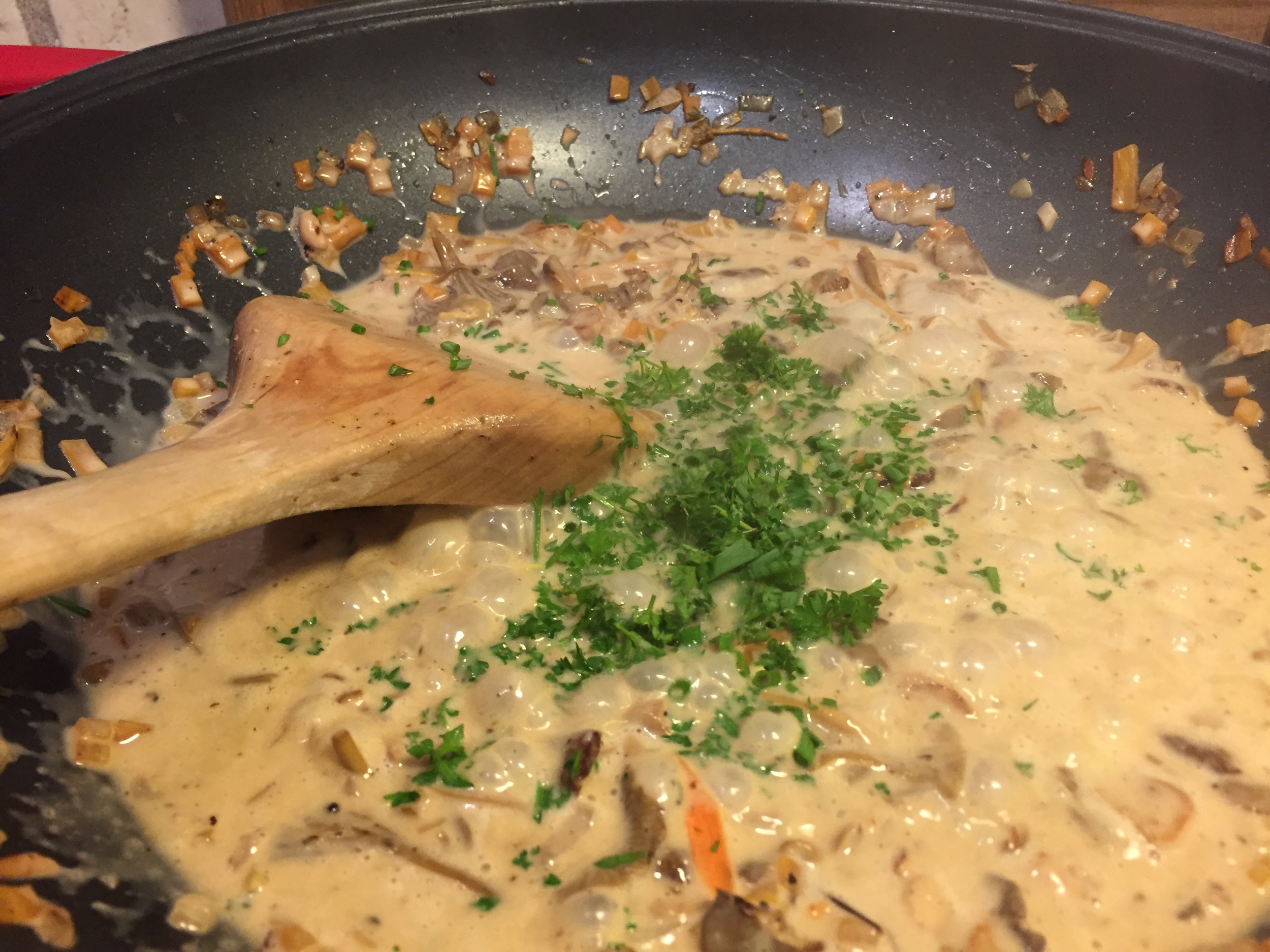 Just before serving, stir in the cream and fresh parsley
