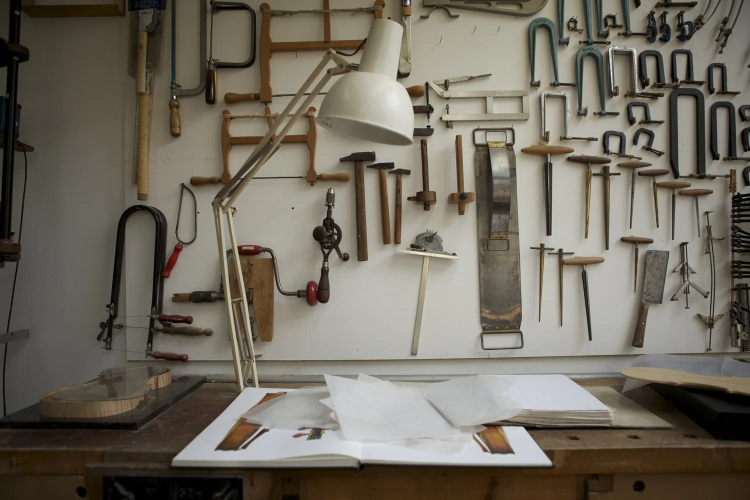 made by hand, hand makers and crafts people photographed in their workshops and studios. Tools, hands, processes and environmental portraits. Black Dog Publishing, Root and Bone Magazine
