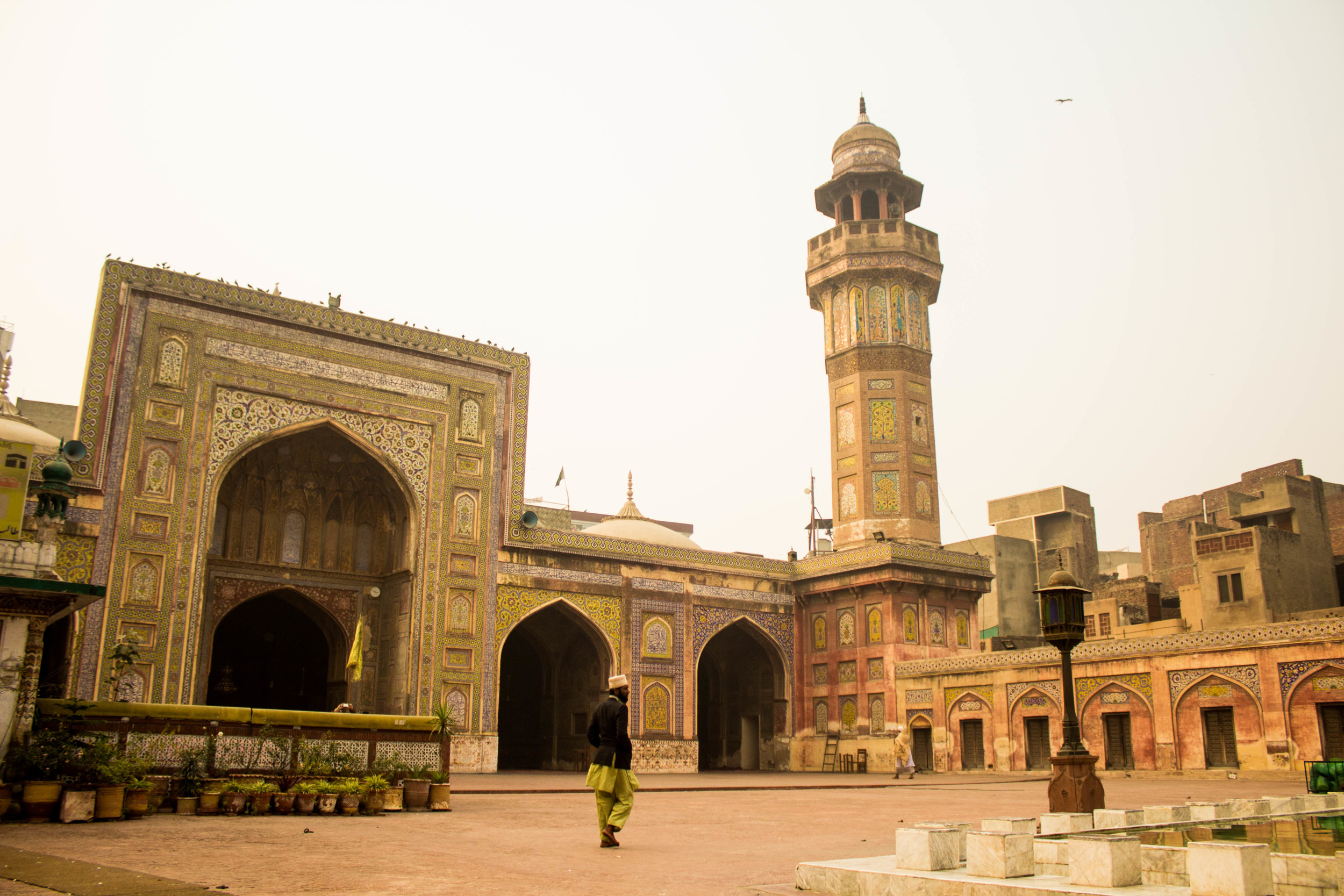 A man strolls through the inner courtyard of the Wazir Khan Masjid in Old Lahore. 