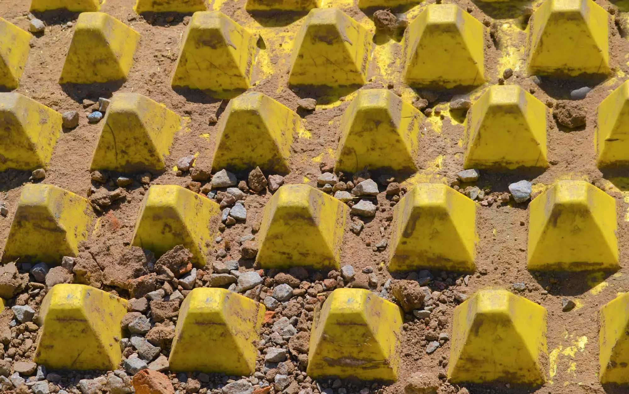 The system prevents large amounts of fugitive dust, dirt and debris from contaminating public streets and highways.