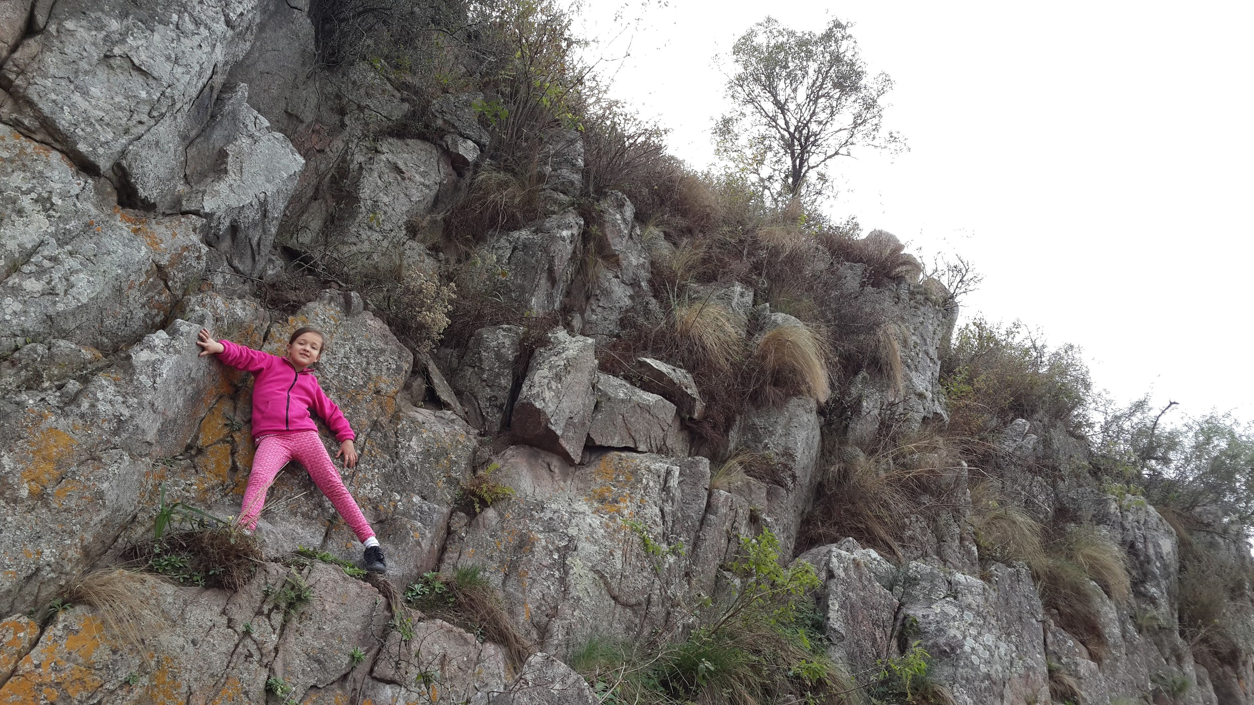 Our 7-year-old scaling a riverbank cliff. No fear! 