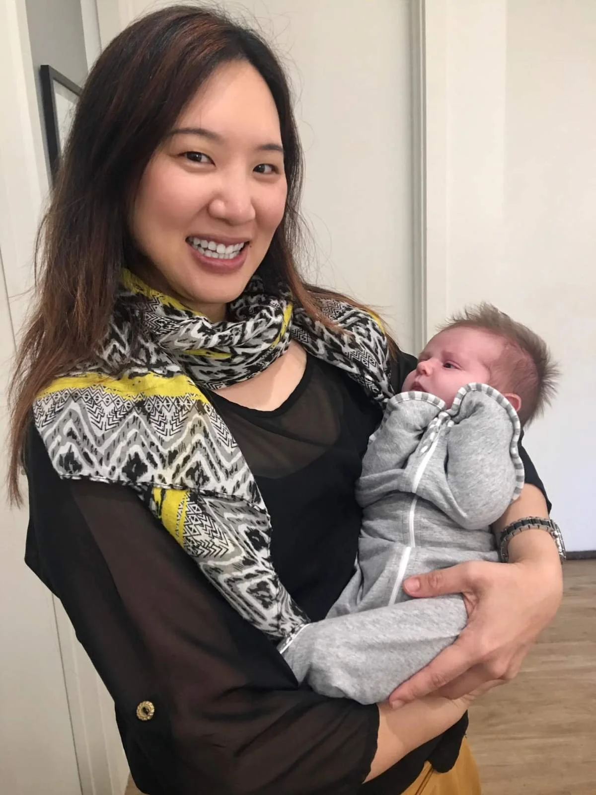 Dr Karen Chan, Adelaide fertility acupuncturist, holding a little baby