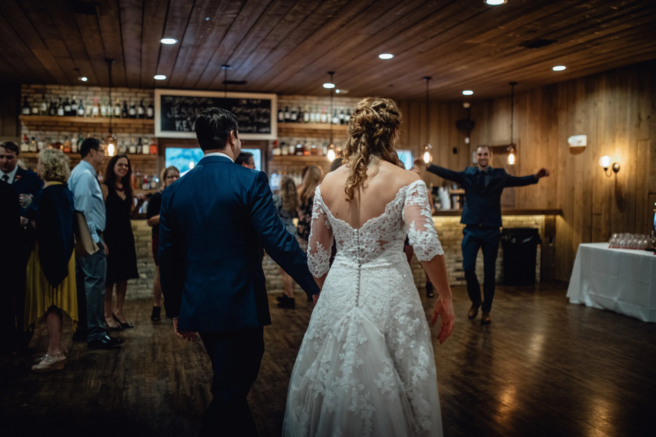 bride-and-groom-entering-reception-at-rustic-manor-1848.jpg