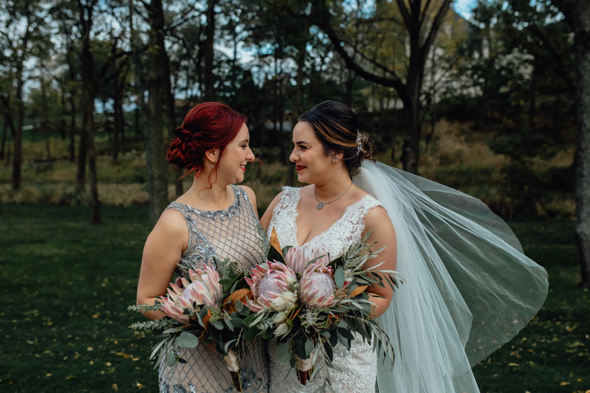 bridesmaid-and bride-in-grass.jpg