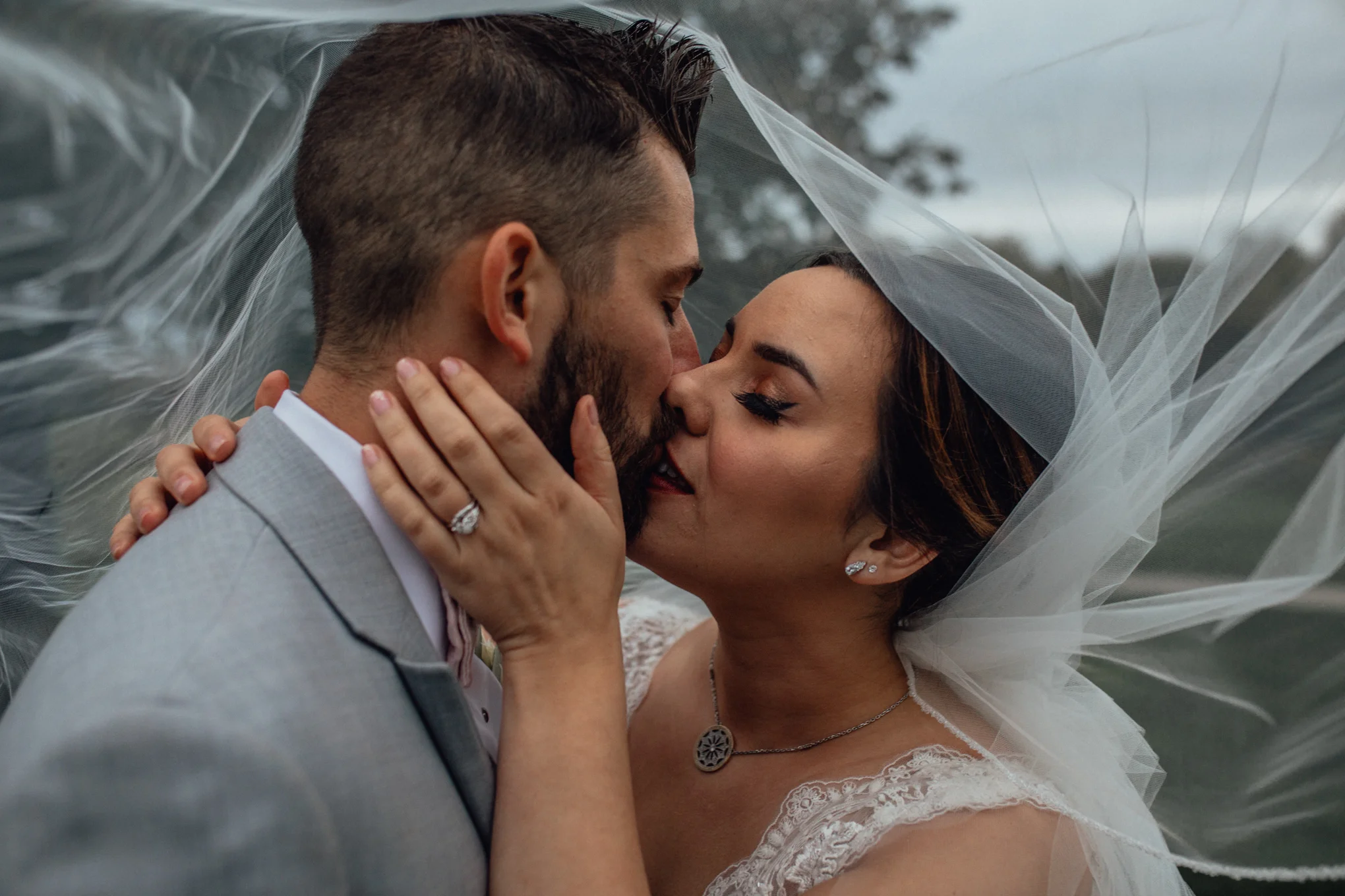 bride-and-groom-on-golf-course-under-veil-at-brandybrook.jpg