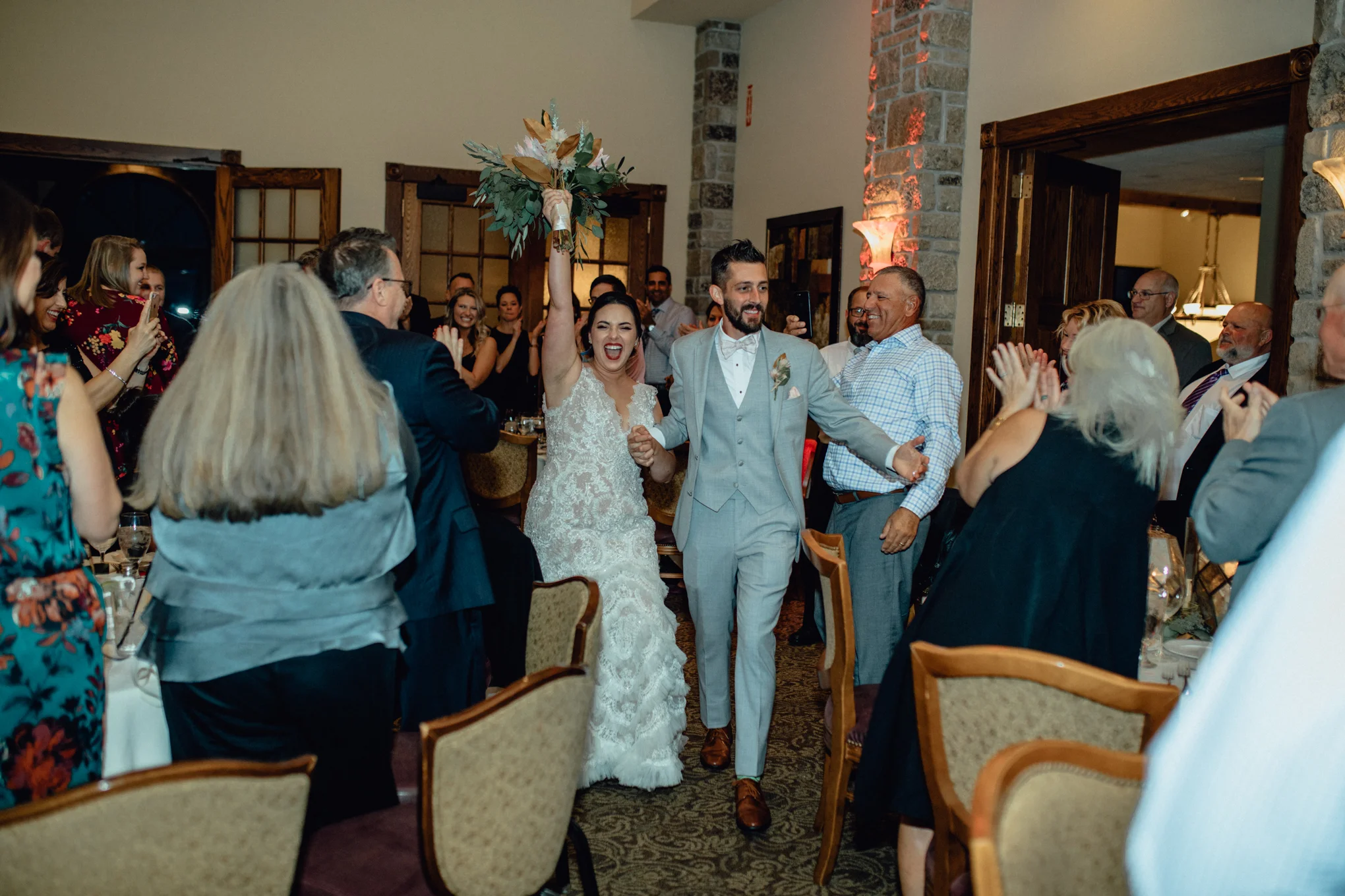 bride-and-groom-entering-wedding-reception.jpg