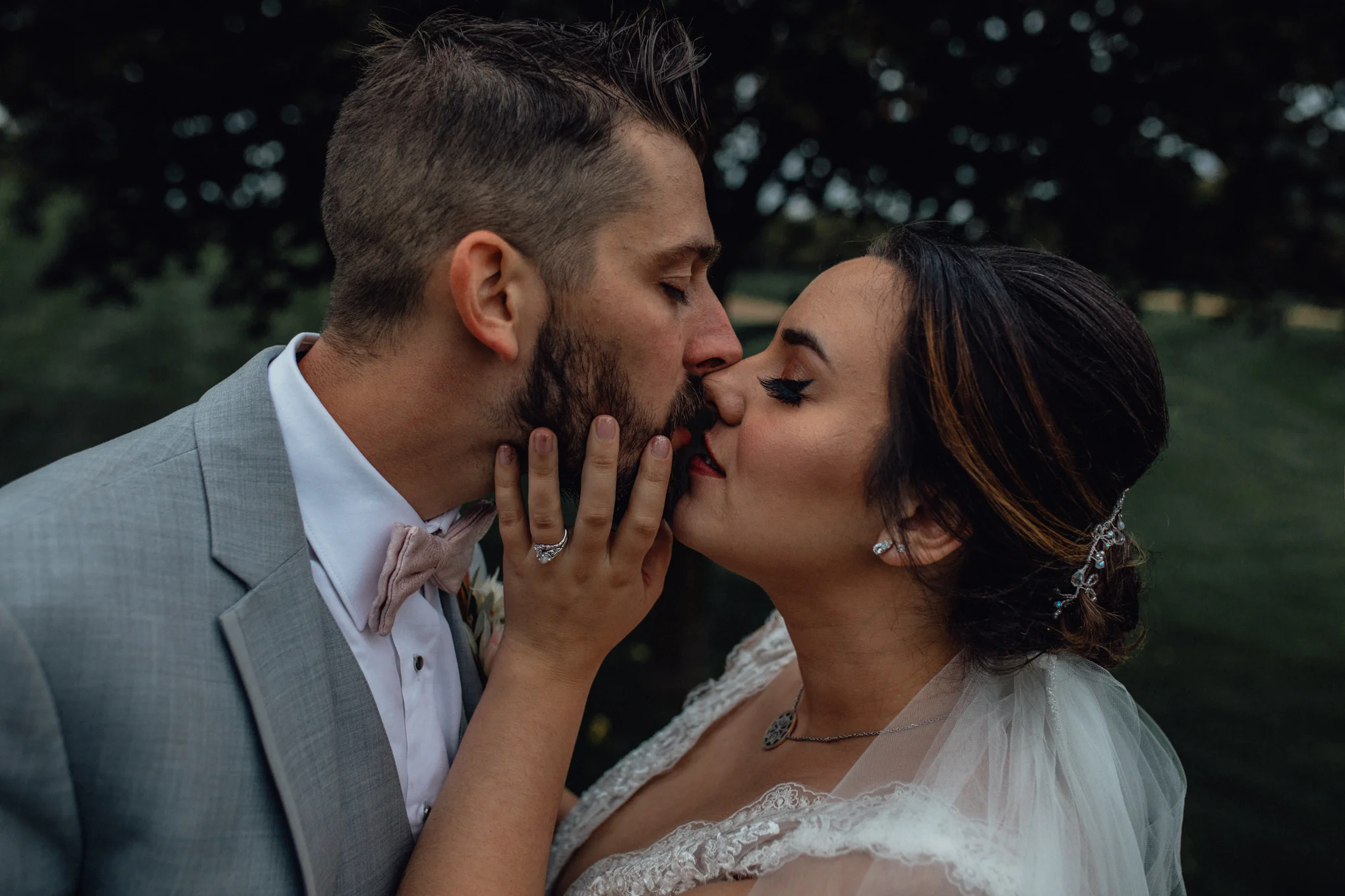 bride-and-groom-kissing-on-golf-course.jpg
