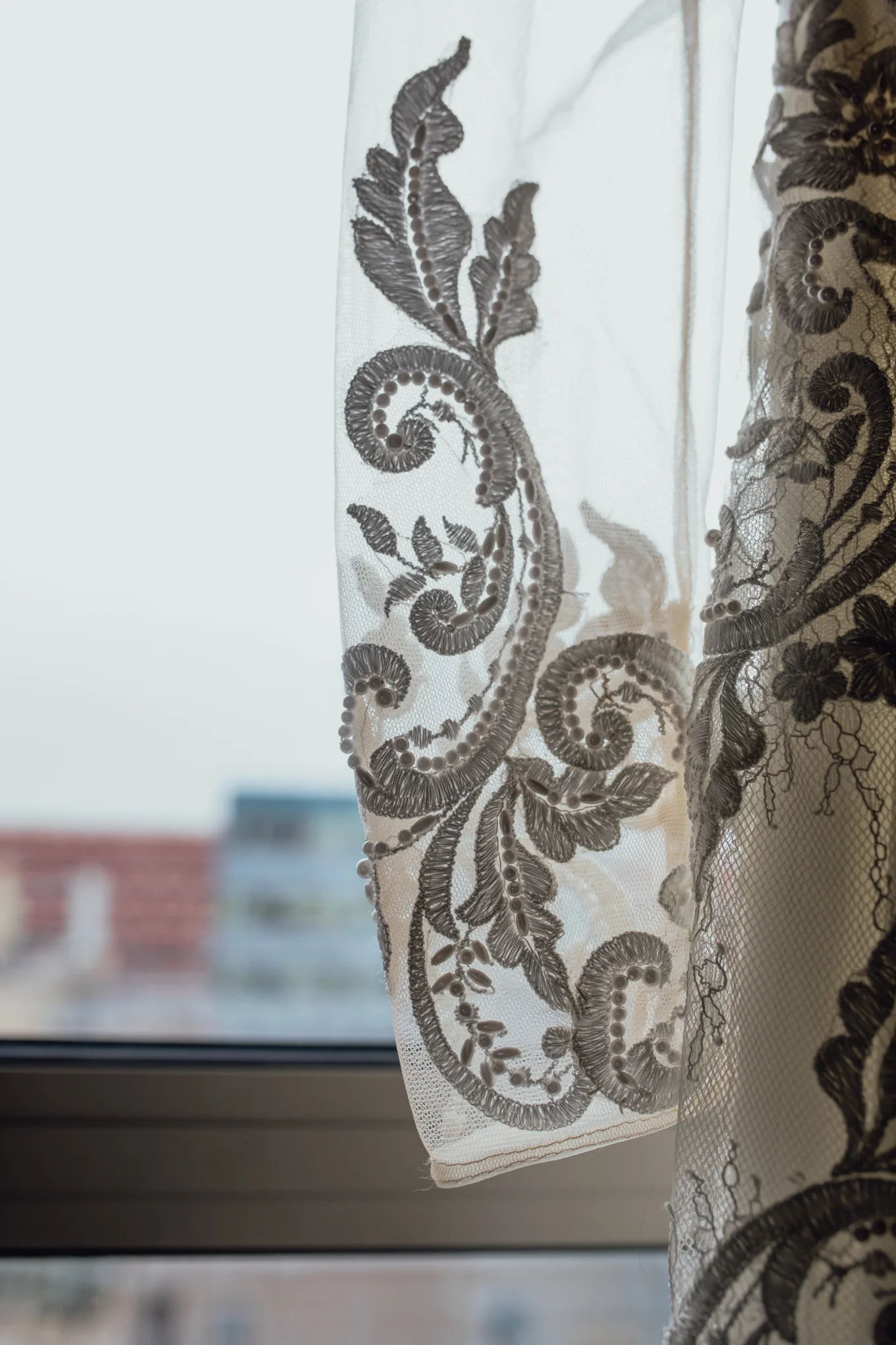 brides-wedding-dress-hanging-in-window.jpg